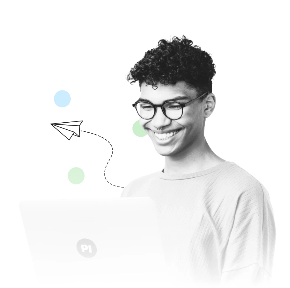 a random man is using a laptop while smiling