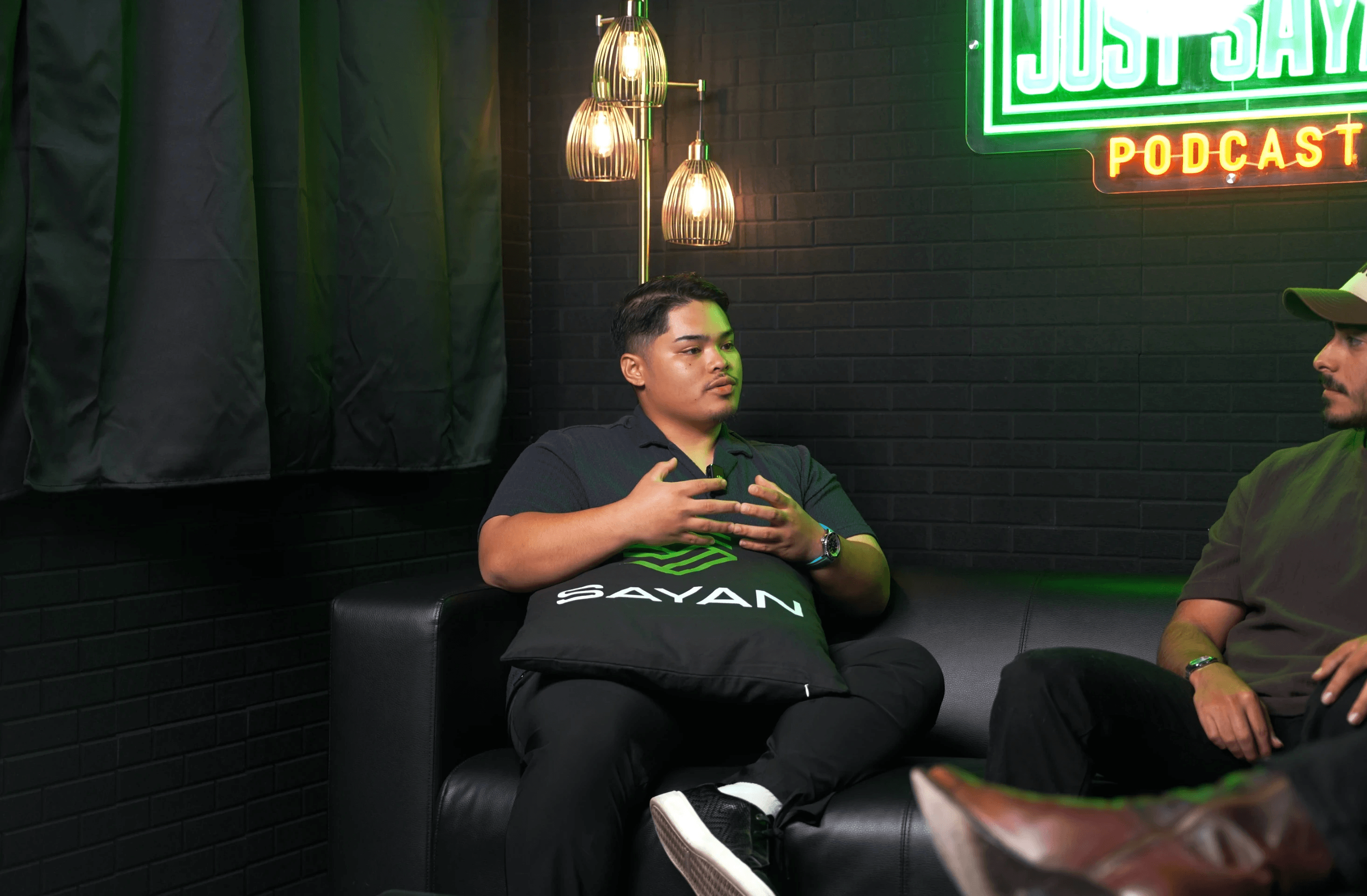 Young Woman Looking at a Person Beside Her