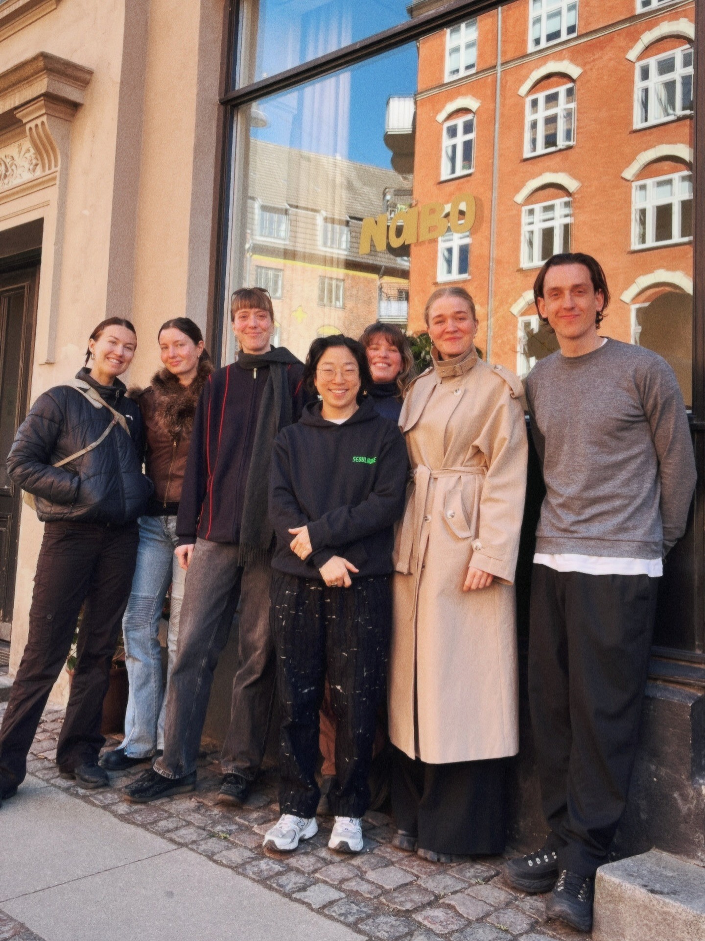 The Nabo kitchen members outside the shop