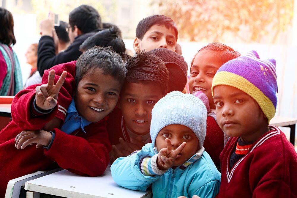 five toddlers near the window