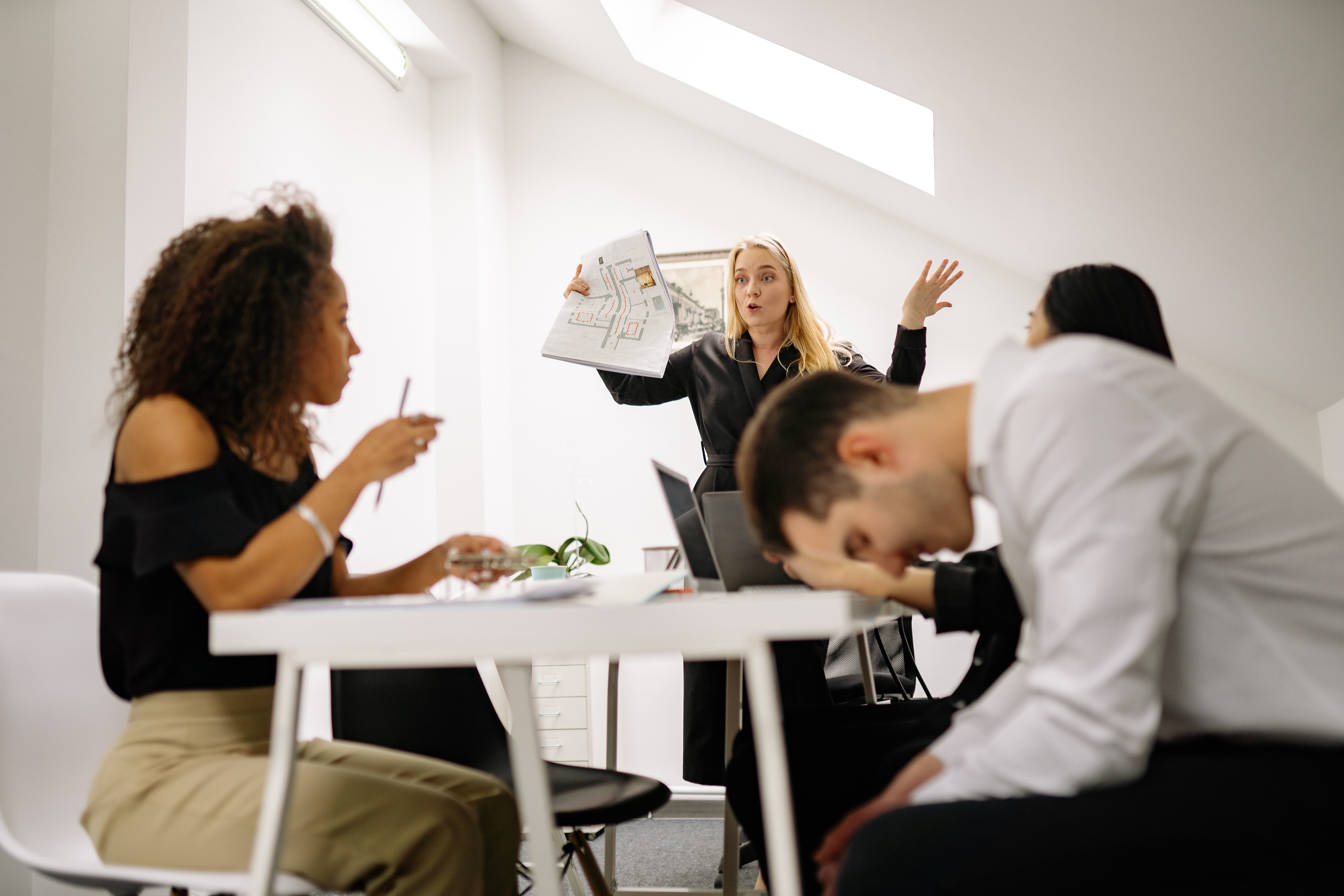 We can see a group of people with their manager being mad on them since they were not able to complete a milestone due to bad training.