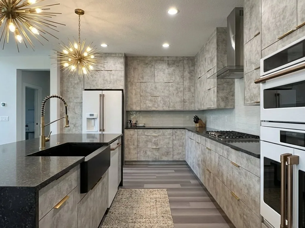 Modern renovated kitchen with new plumbing fixtures, countertops, and appliances.