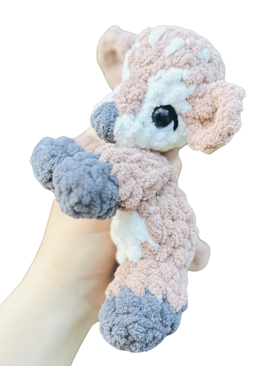 A handcrafted knitted hedgehog toy featuring a soft cream-colored body and intricately detailed, textured brown spines, perfect for children and collectors.