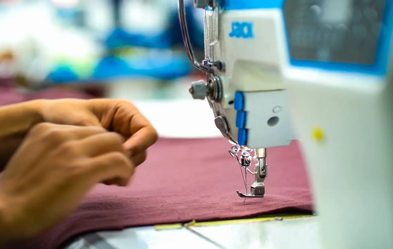 employee who works on the knitting machine.
