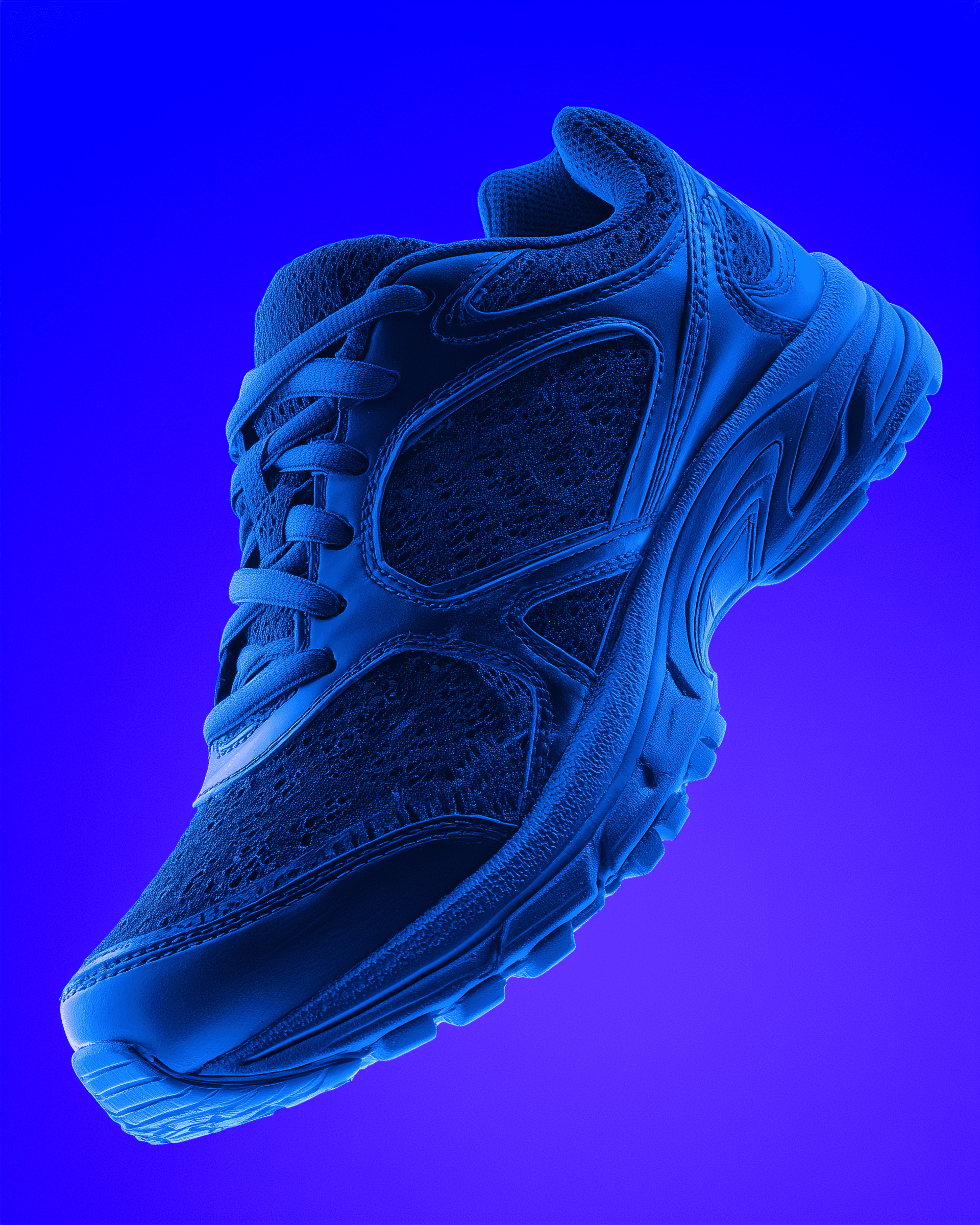 Woman in white iridescent jacket standing still and sharp in focus amid a crowd of blurred moving figures