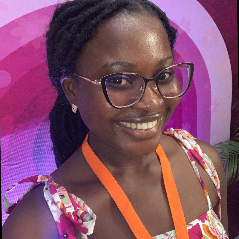 a man with a goatee smiles at the camera