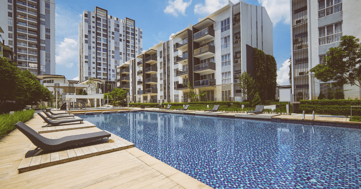 A swimming pool by apartment buildings