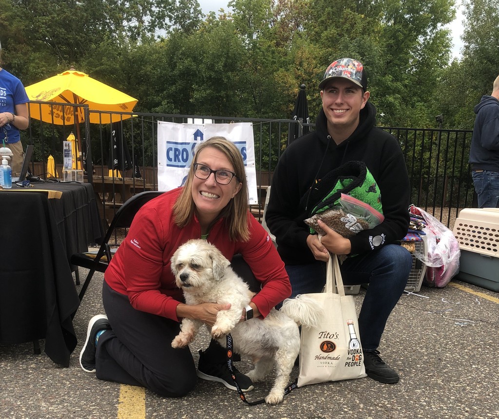 Someone petting dog's chin