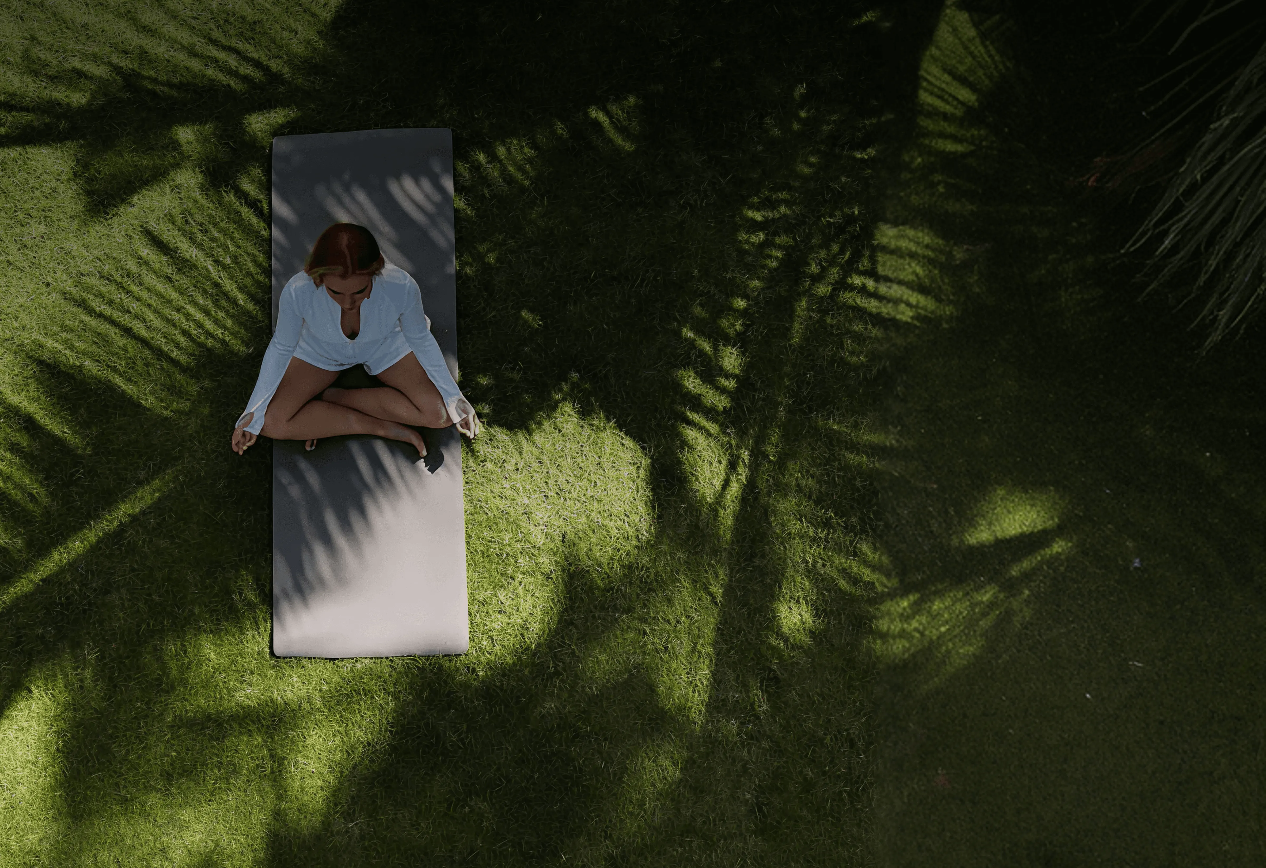 Women doing yoga in open area