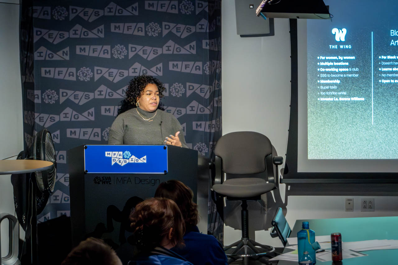Woman at a podium delivering a presentation