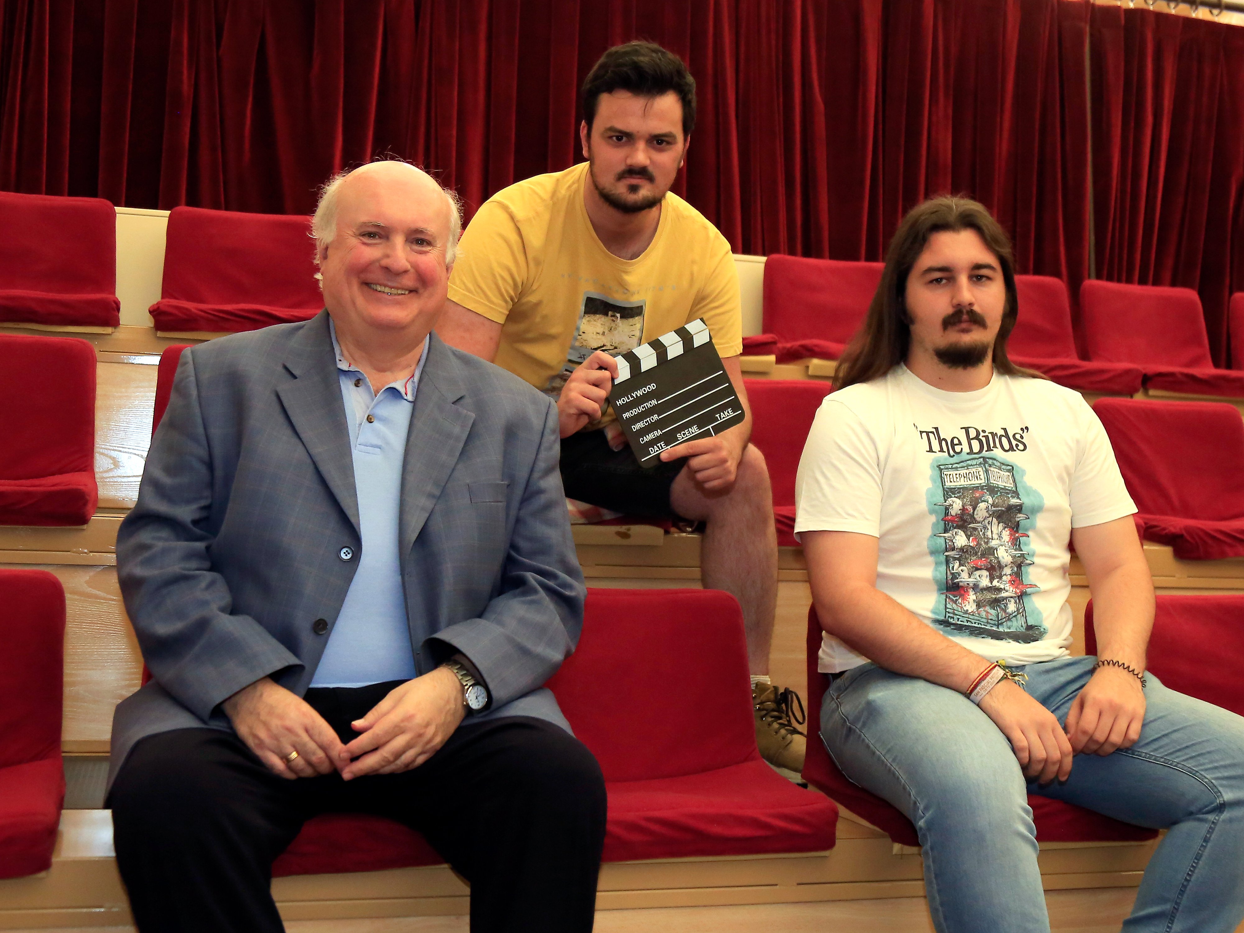 A person stands in a sandstone cave.