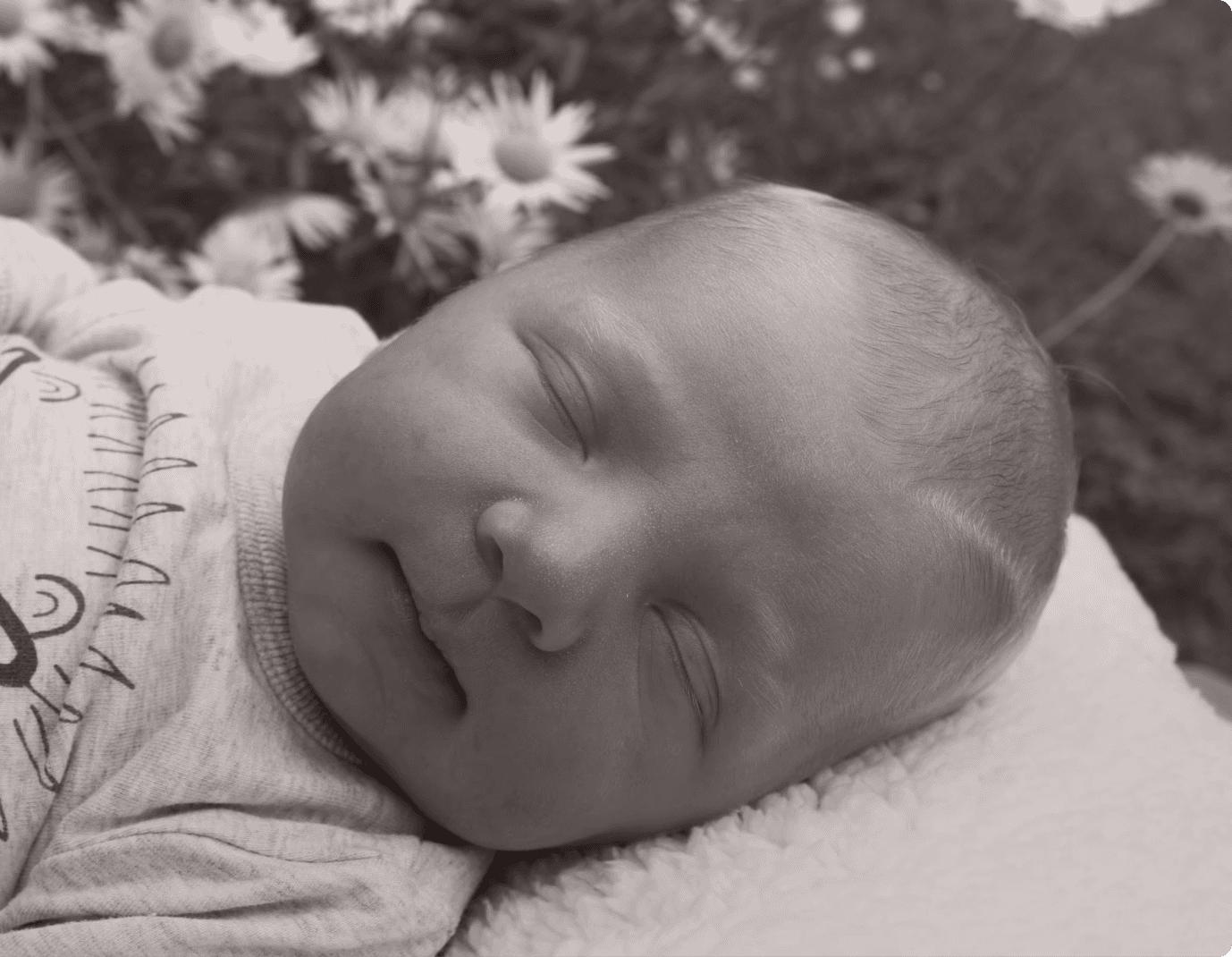 Baby boy sleeping in Garden