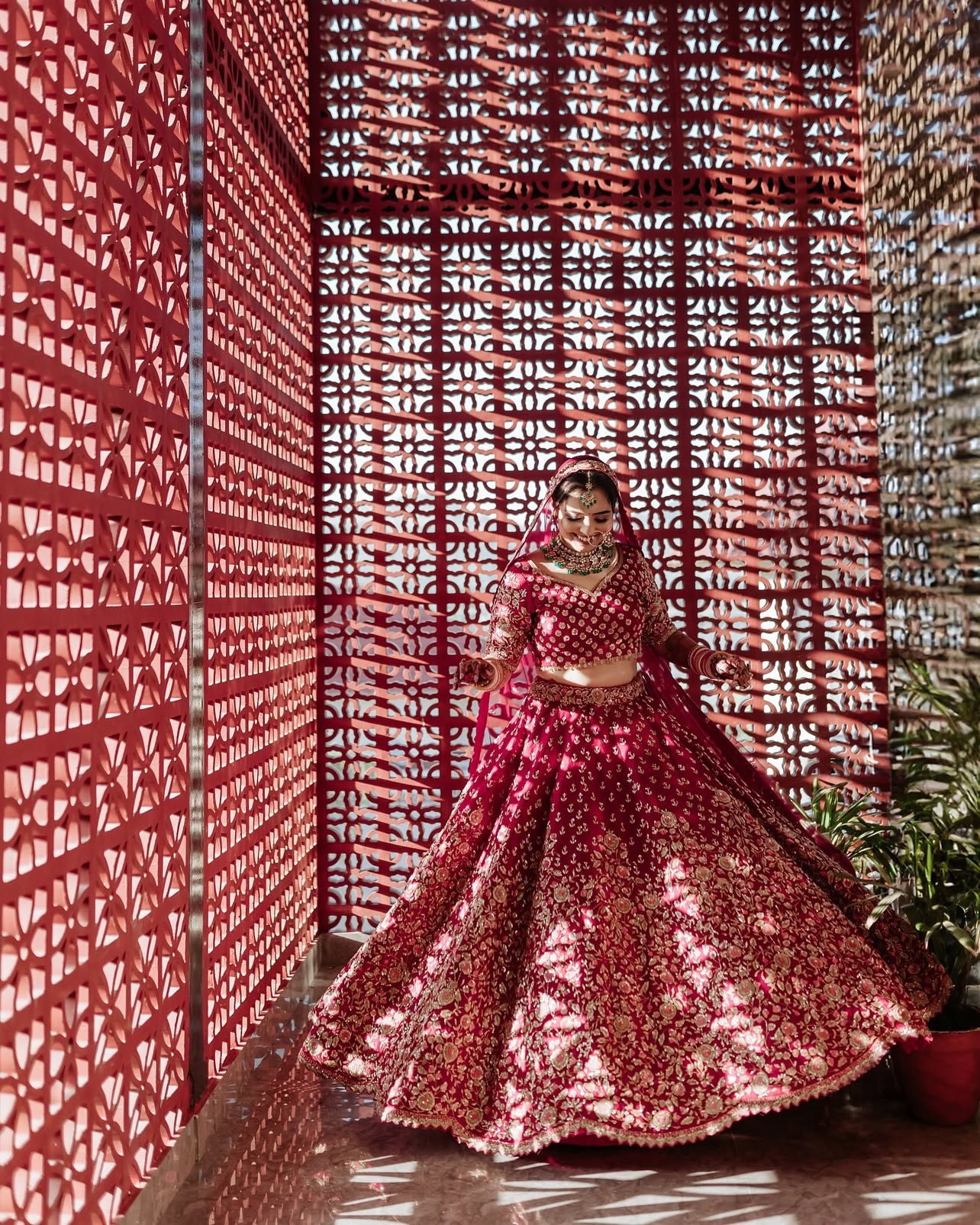 woman in white floral wedding dress holding bouquet of flowers