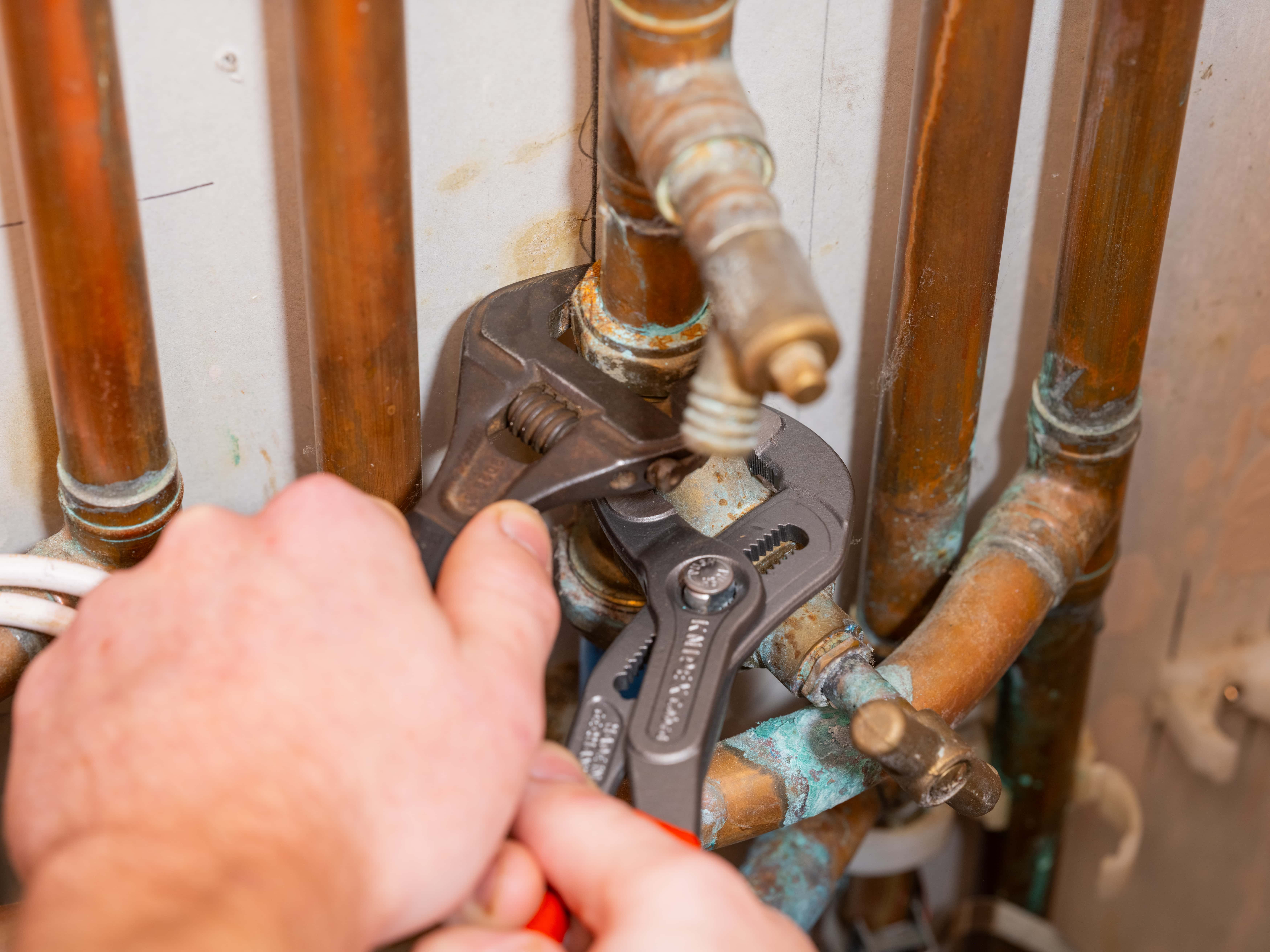 Trusted gas safe engineer carrying out a boiler service in north london