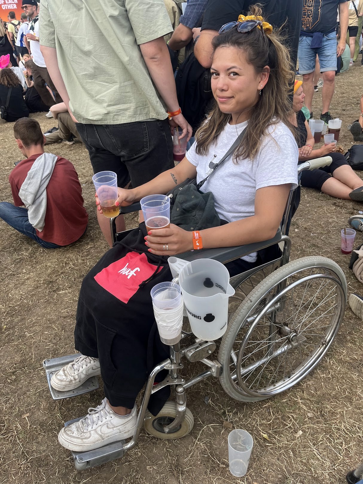 A beautifully set dining table with white tablecloth, cutlery, and fresh greenery in a cozy, well-lit space.