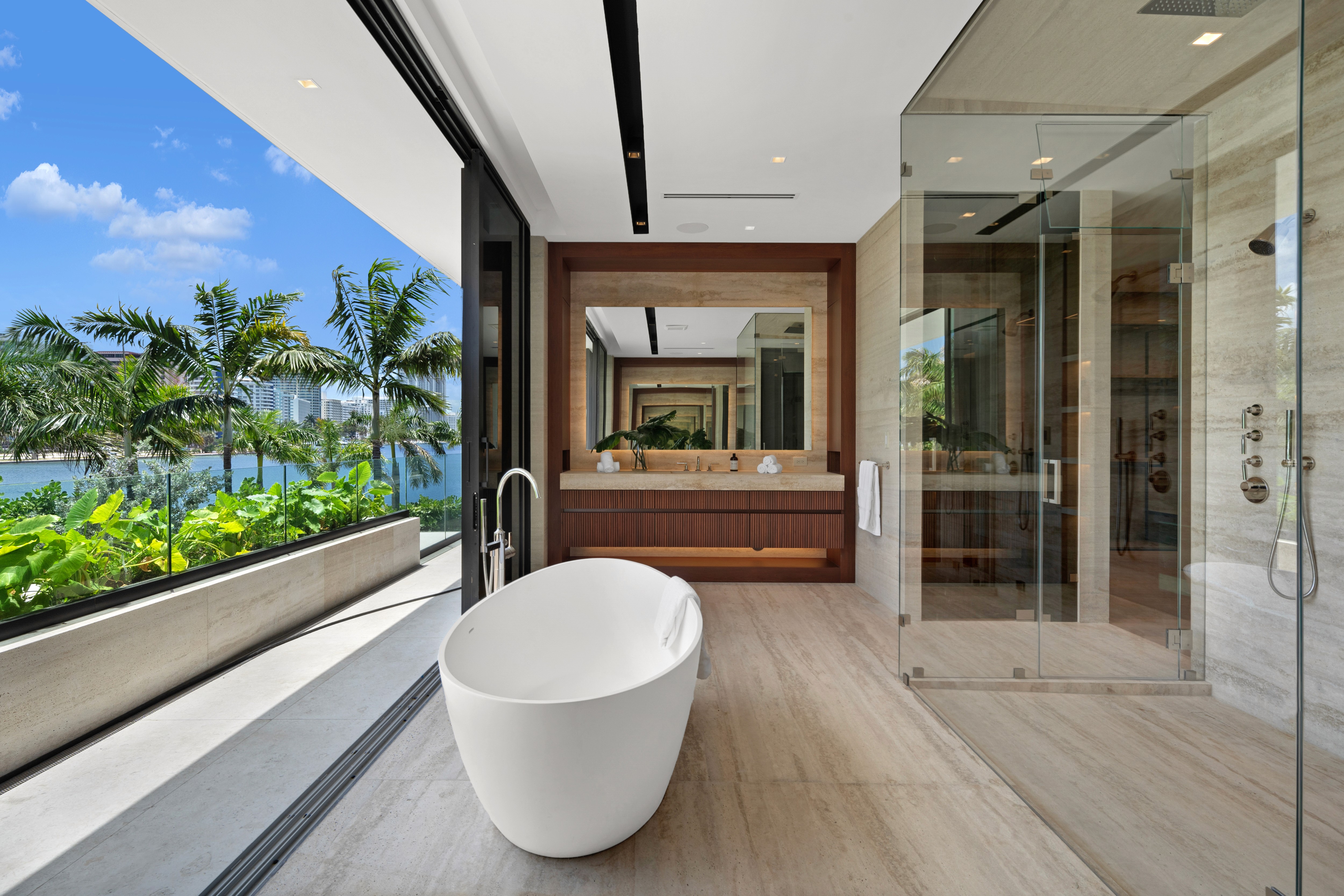A group of people praticing yoga on the beach in the morning