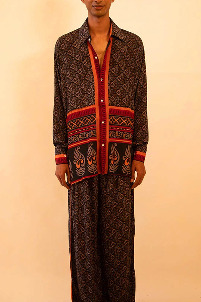 Black and red silk shirt and pant set handcrafted from a vintage sari, featuring a relaxed fit, soft breathable texture, and contrast button detailing