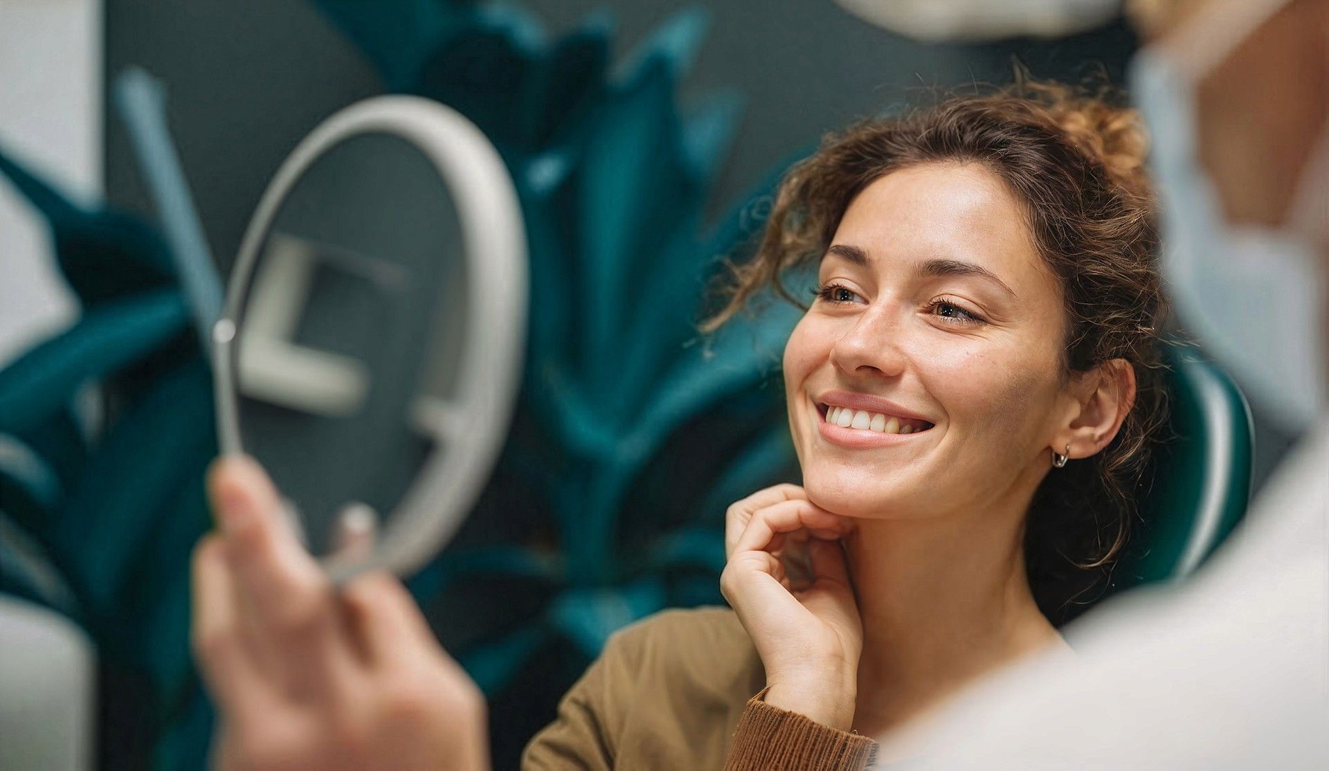 woman looking in a mirror and smiling