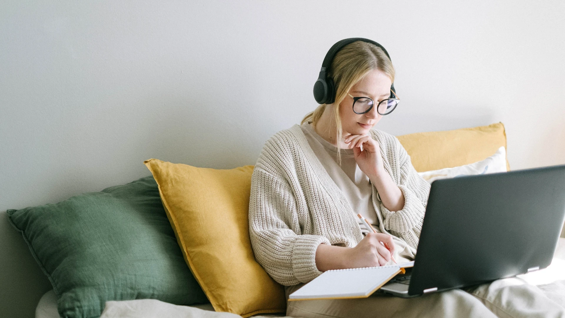 woman sitting couch laptop