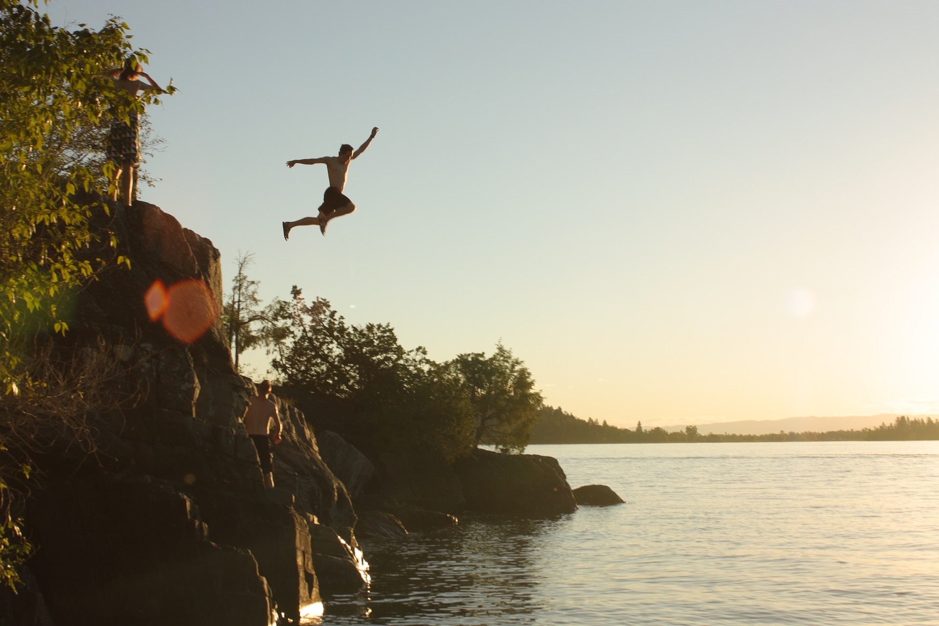 A man jumping into a lake