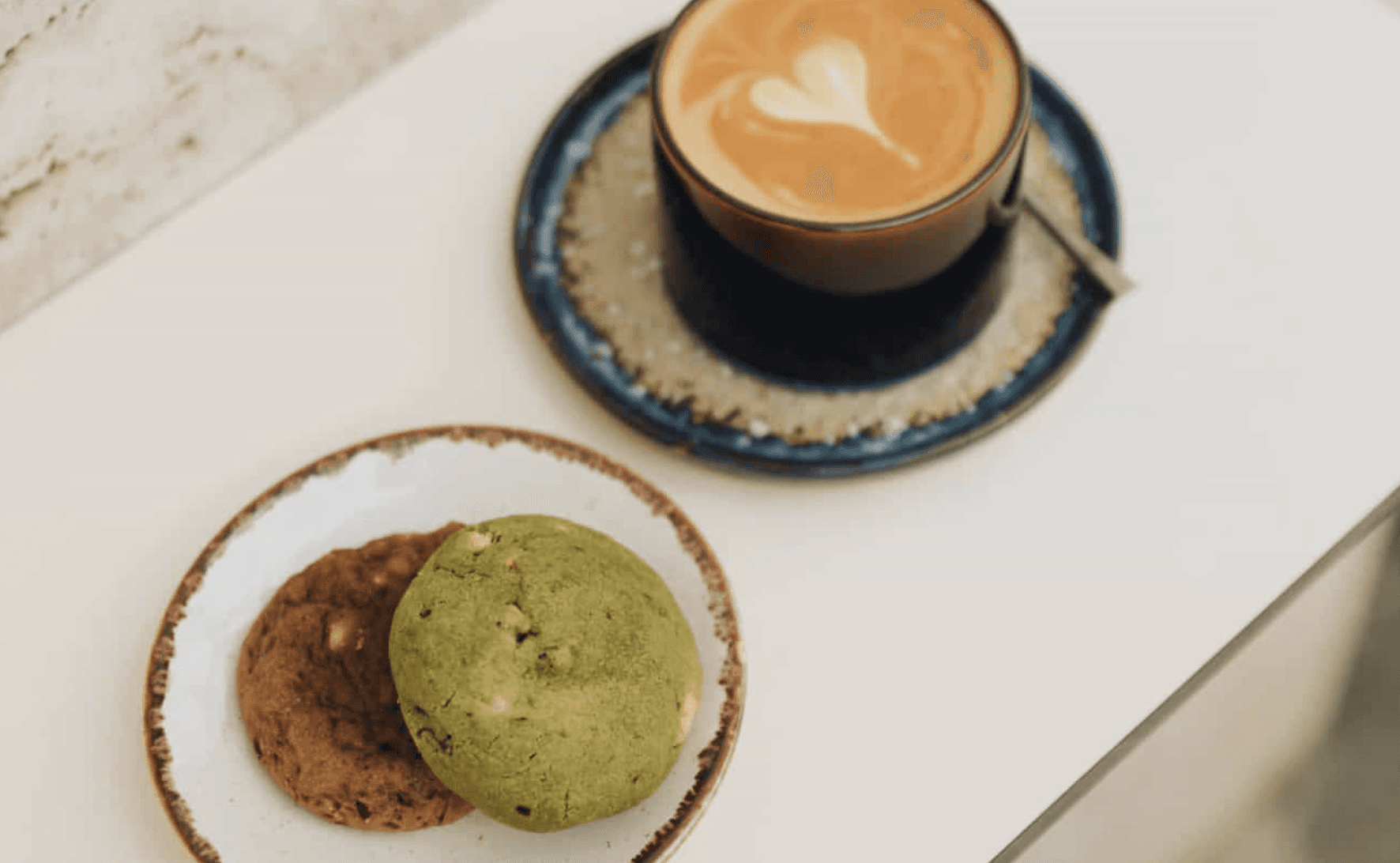 Latte with two homemade cookies served at Jo & The Sisters breakfast café in Split