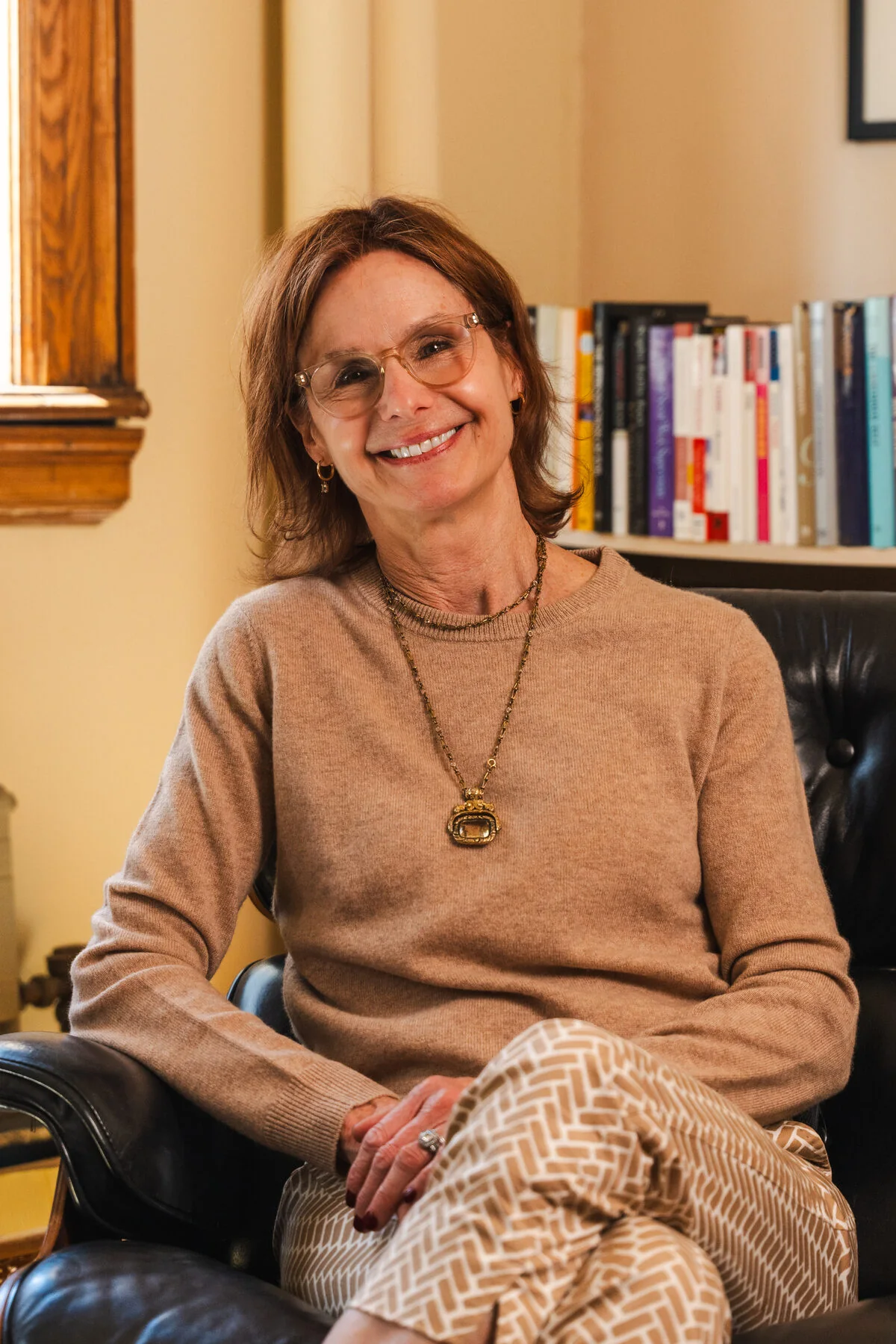 Wendy Cleary smiling while seated in her office