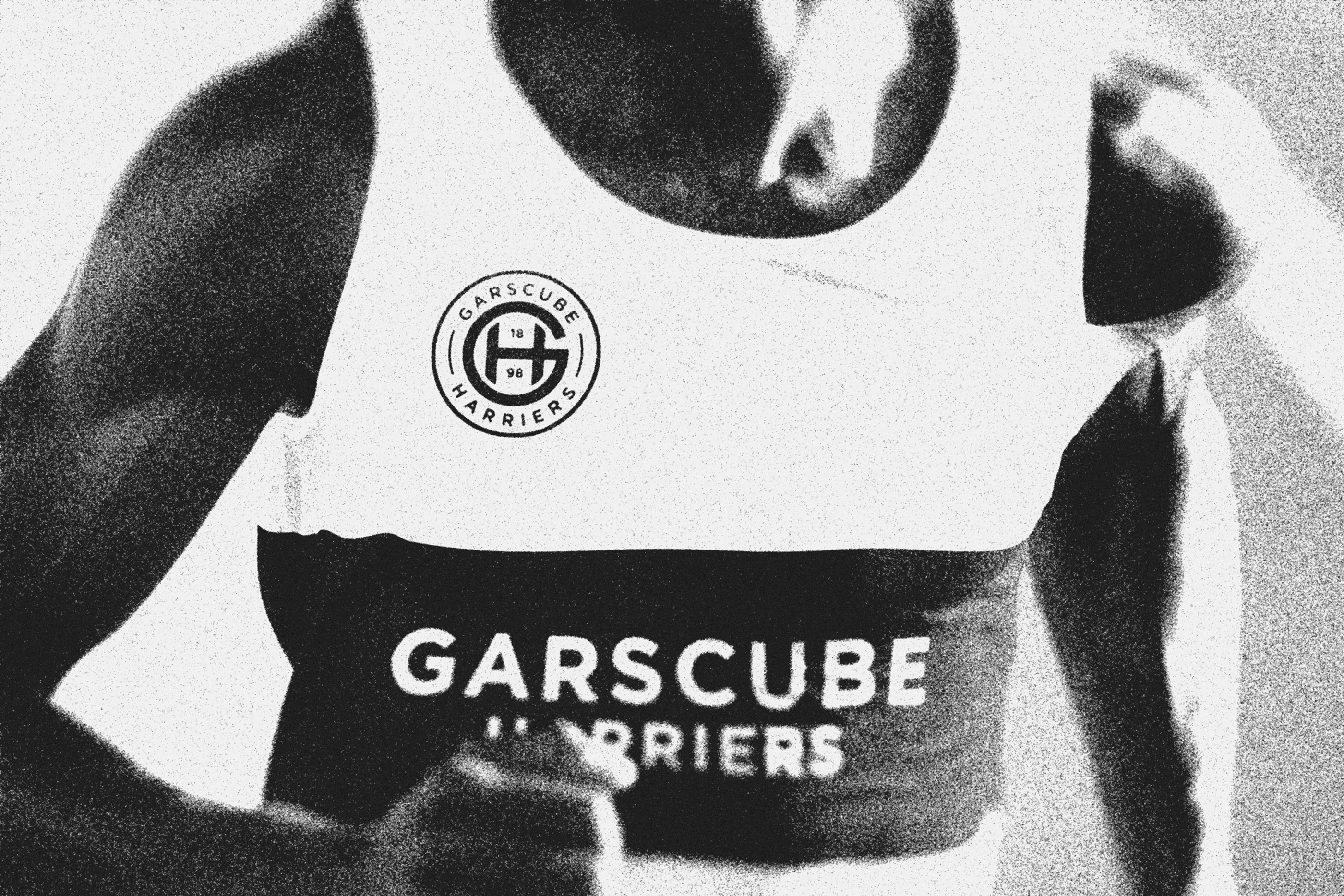 Black and white image of runner wearing Garscube Harriers singlet