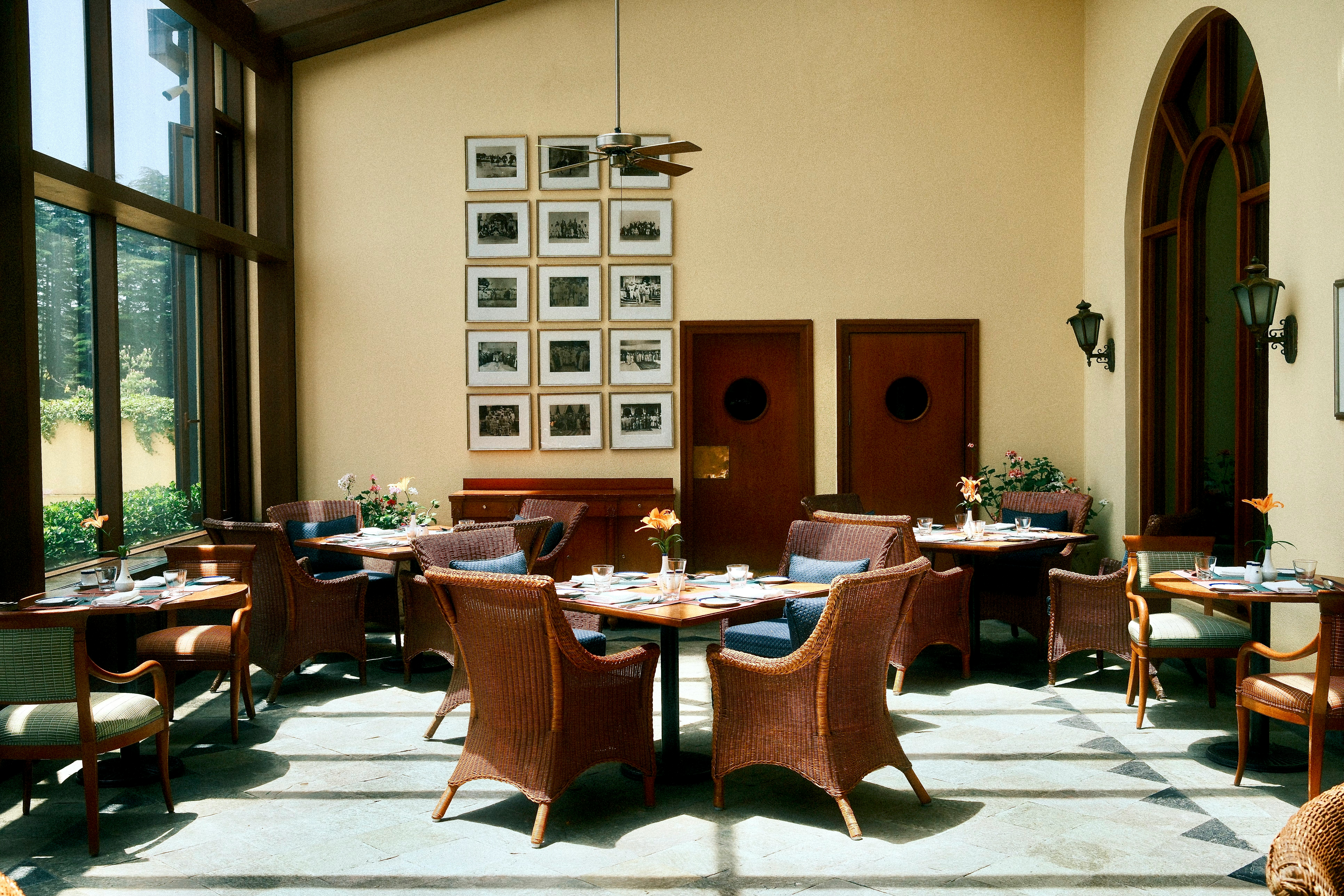 Cozy restaurant dining area with wicker chairs.