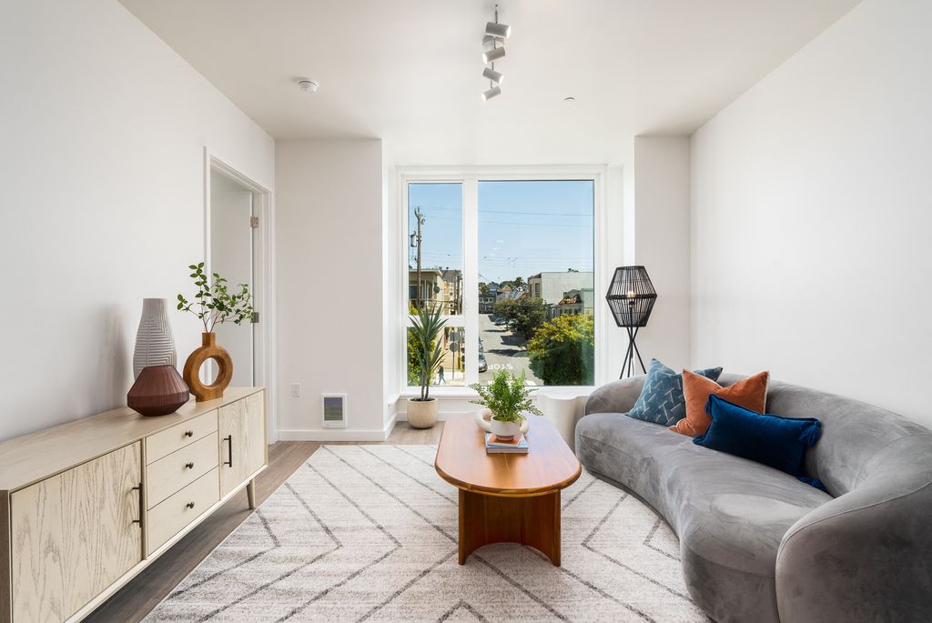 Contemporary residential complex featuring sleek architecture, expansive glass windows, and landscaped surroundings.