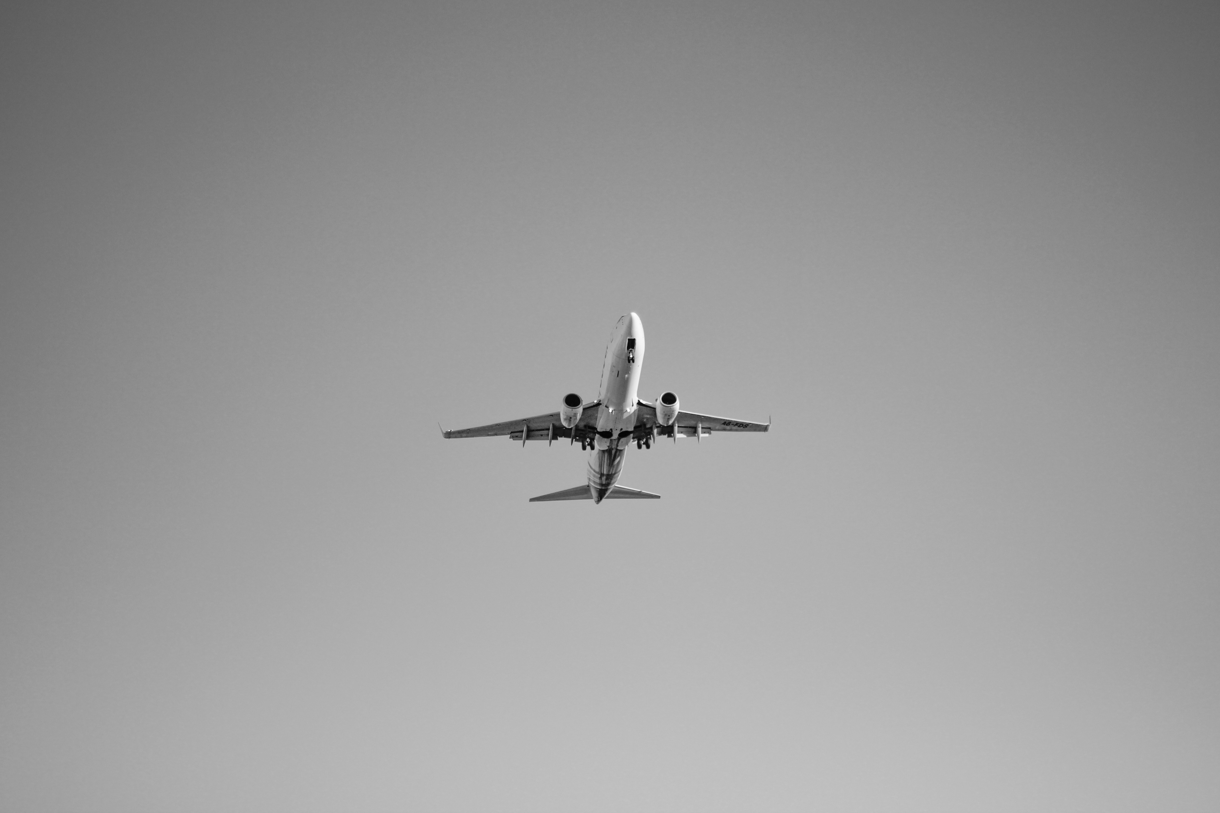 white airplane in mid air