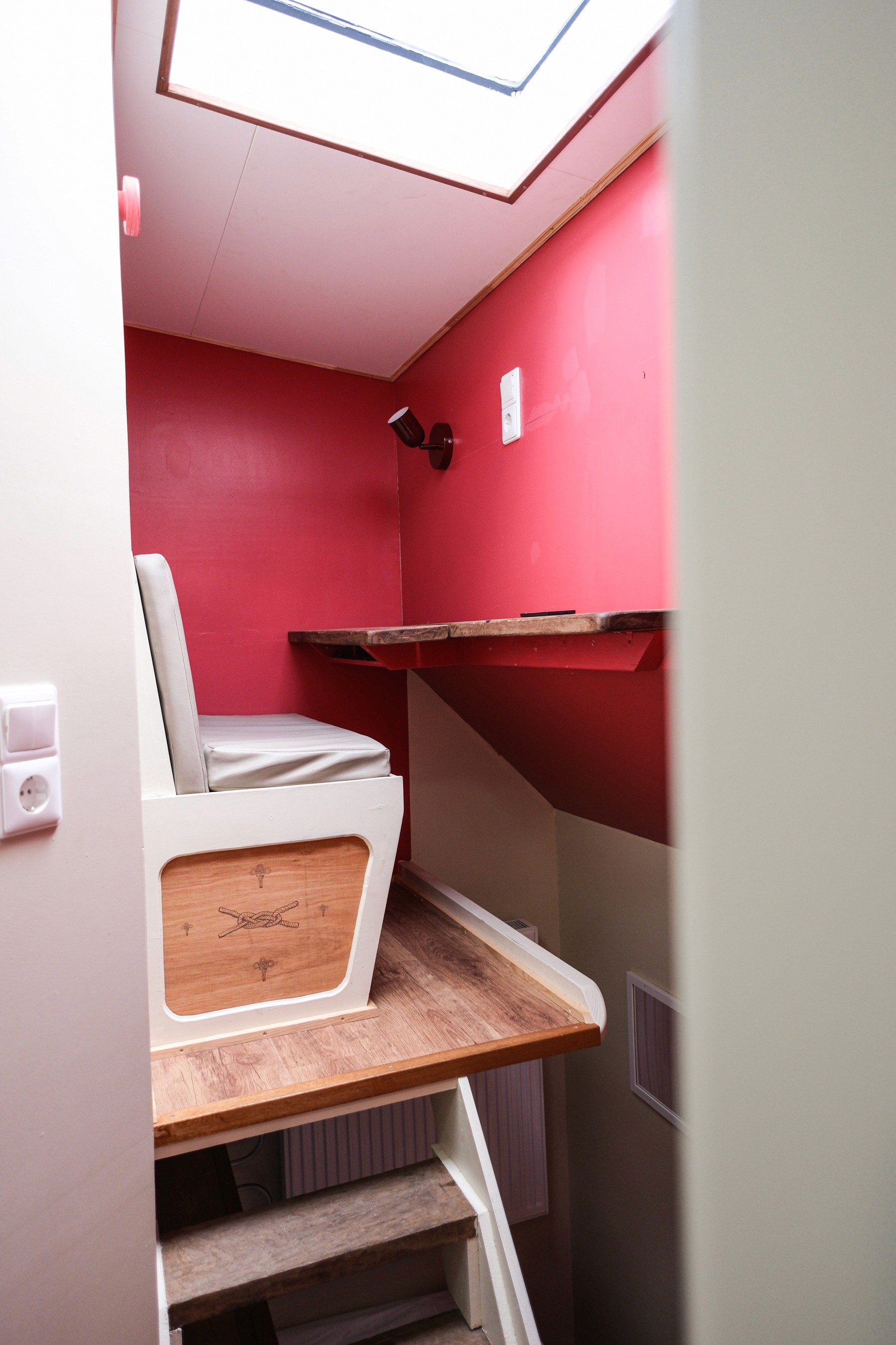 Gray sectional sofa with black coffee table and blue rug