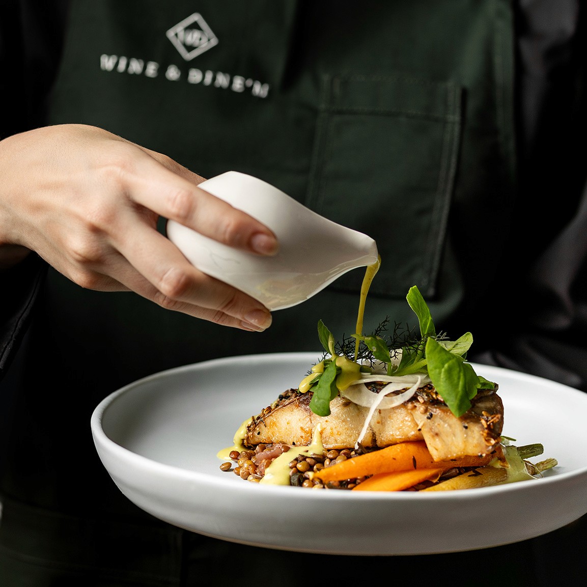 Seed-crusted barramundi, lentils, carrots, native curry, Warrigal greens & fennel