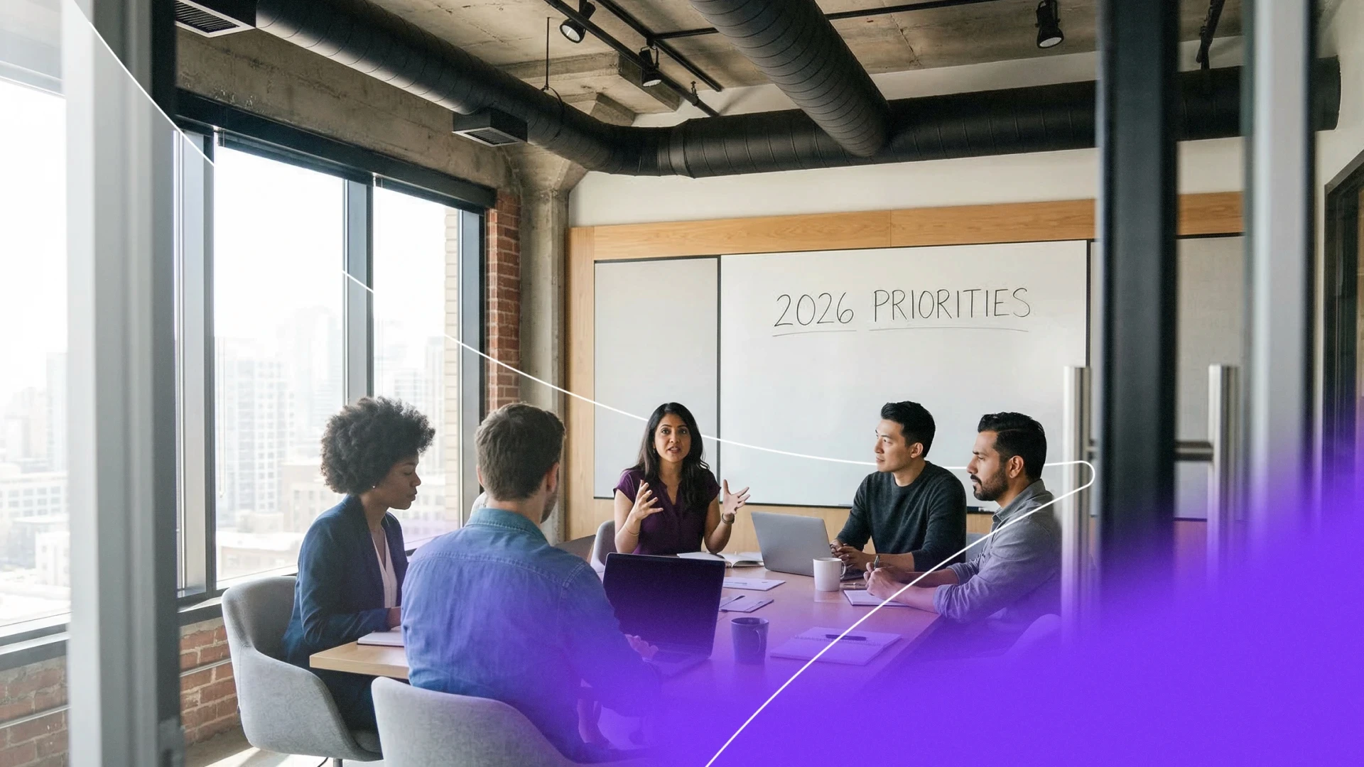 A diverse team of MSPs in a modern office discussing 2026 MSP priorities for ransomware defense and identity management.