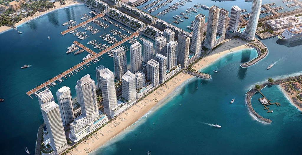 A panoramic view of Emaar Beachfront Bay showcasing contemporary buildings against a backdrop of the ocean and city skyline.