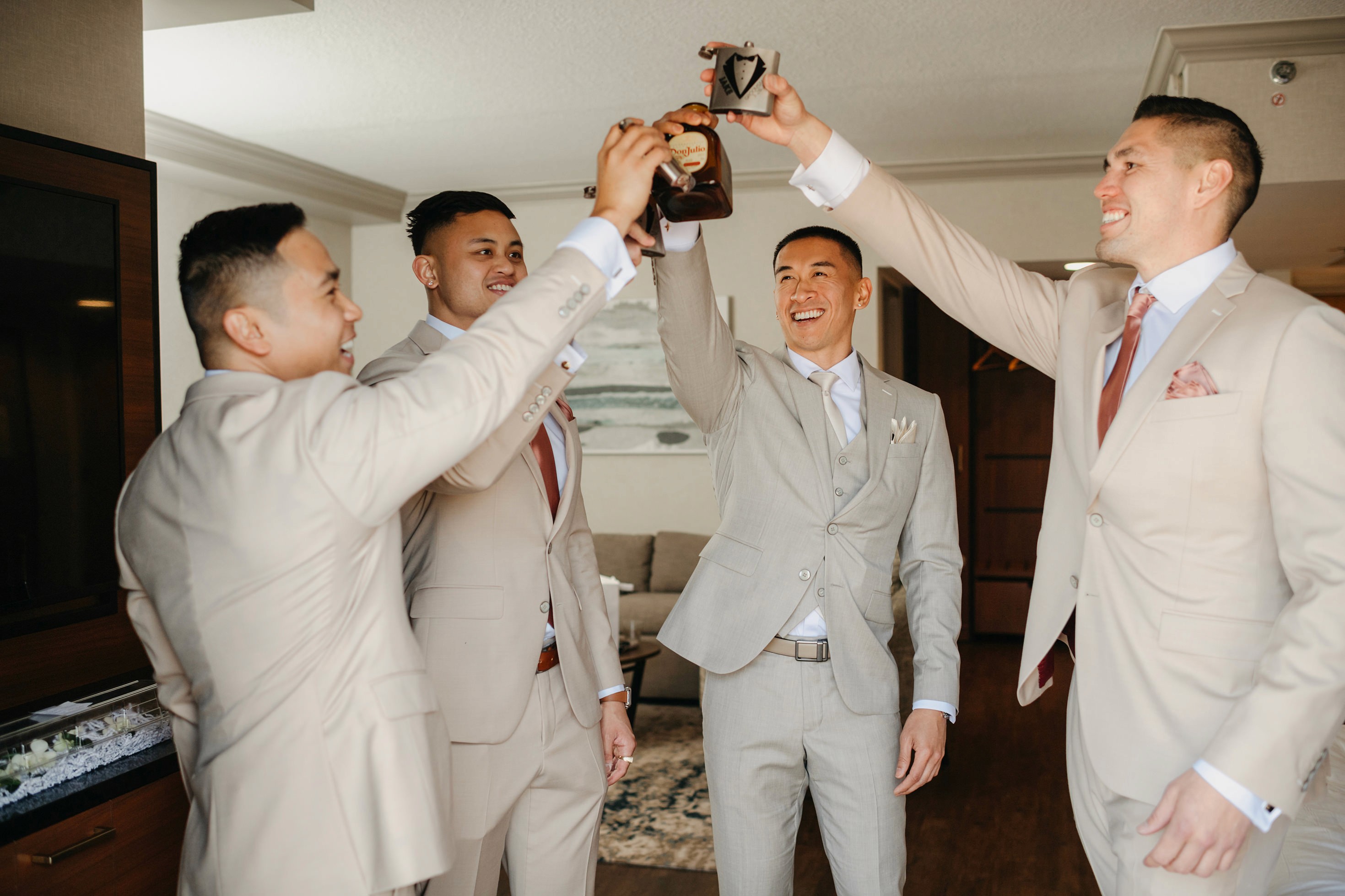 Groomsmen group portrait in matching neutral suits