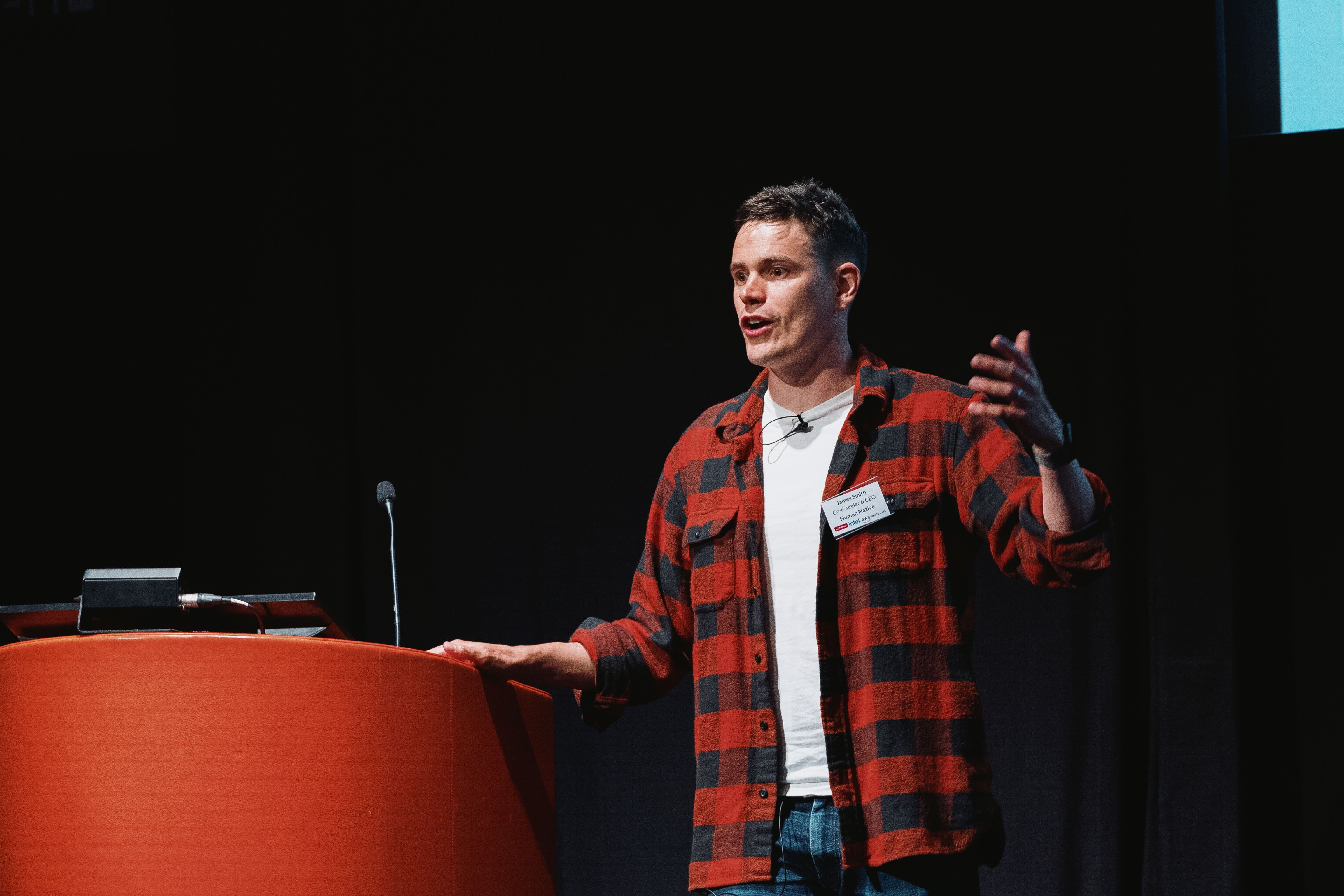 A person presenting on stage