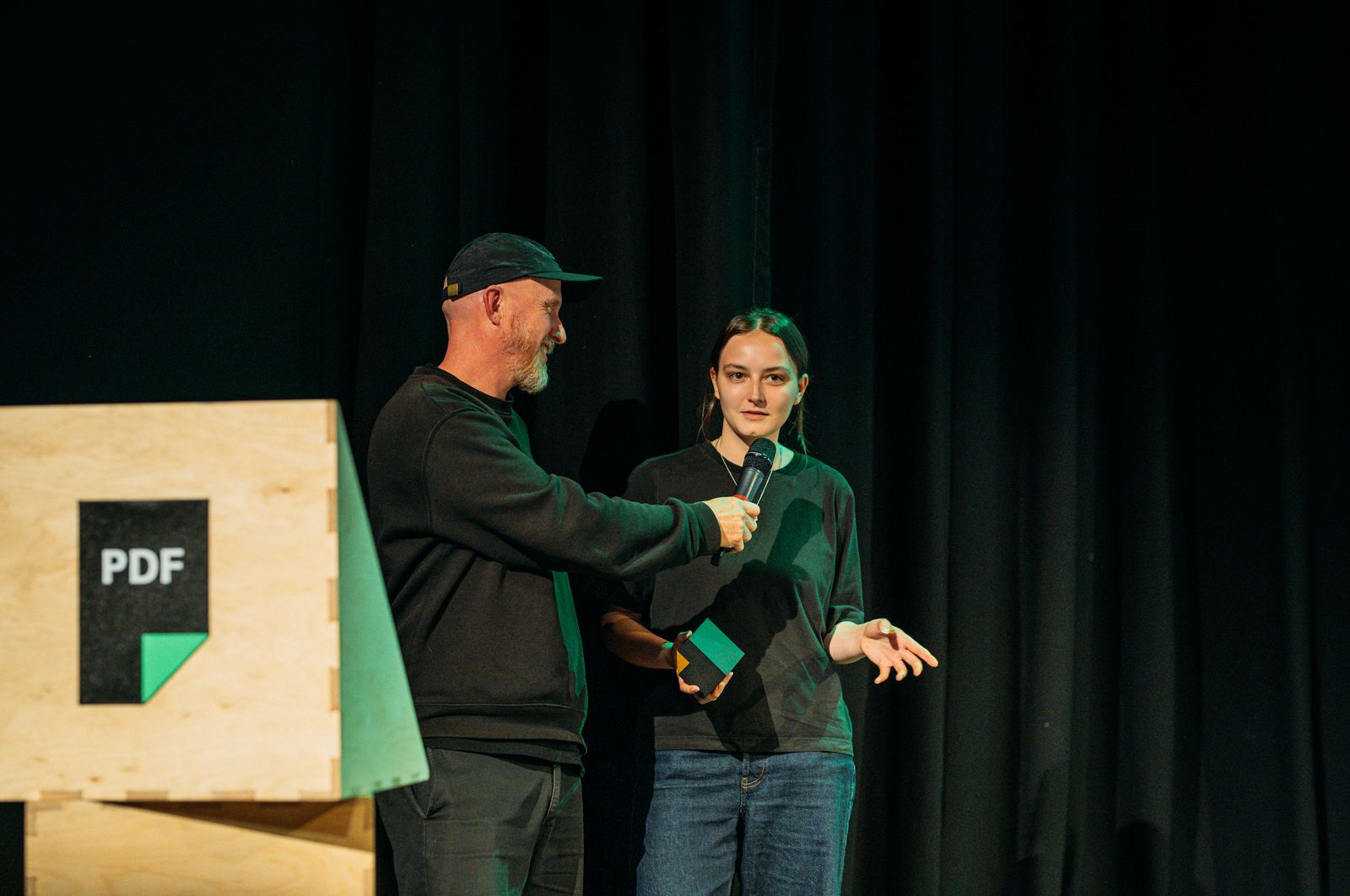 a blurry photo of a person standing in front of a wall