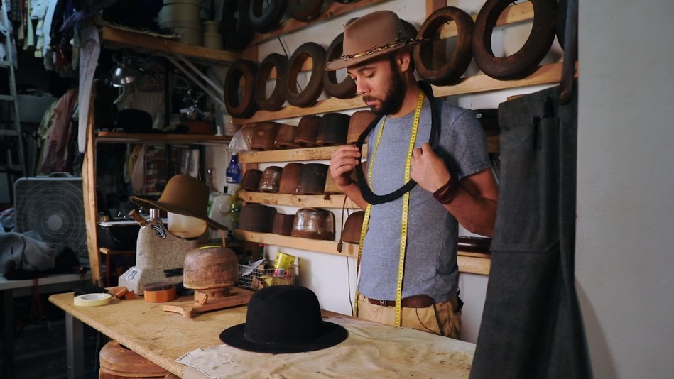 man with hat and beard in hat shop