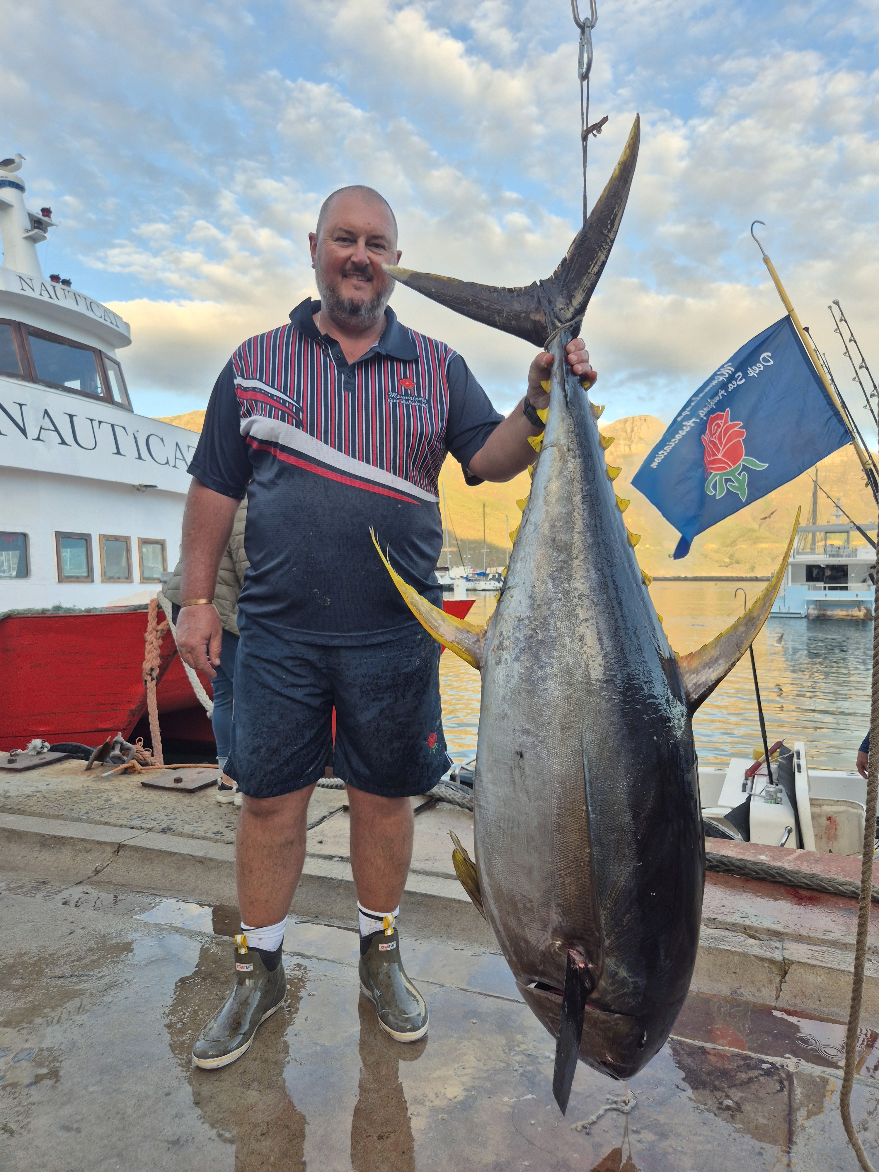 Fishermen celebrating a successful catch on a Salt Safari charter.