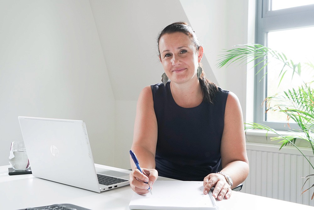 Hughes Price Walker administrator taking notes while supporting pension scheme onboarding.