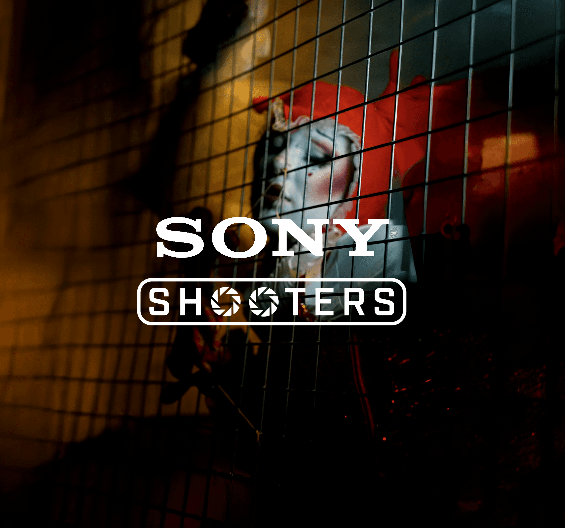 Sony and UK shooters logo on a dark background with a woman model and cinematic lights in a cage