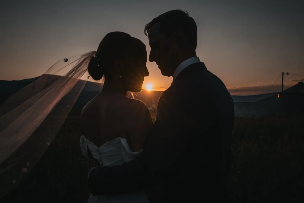 Sunset silhouette of couple during Carbondale Private Ranch Wedding
