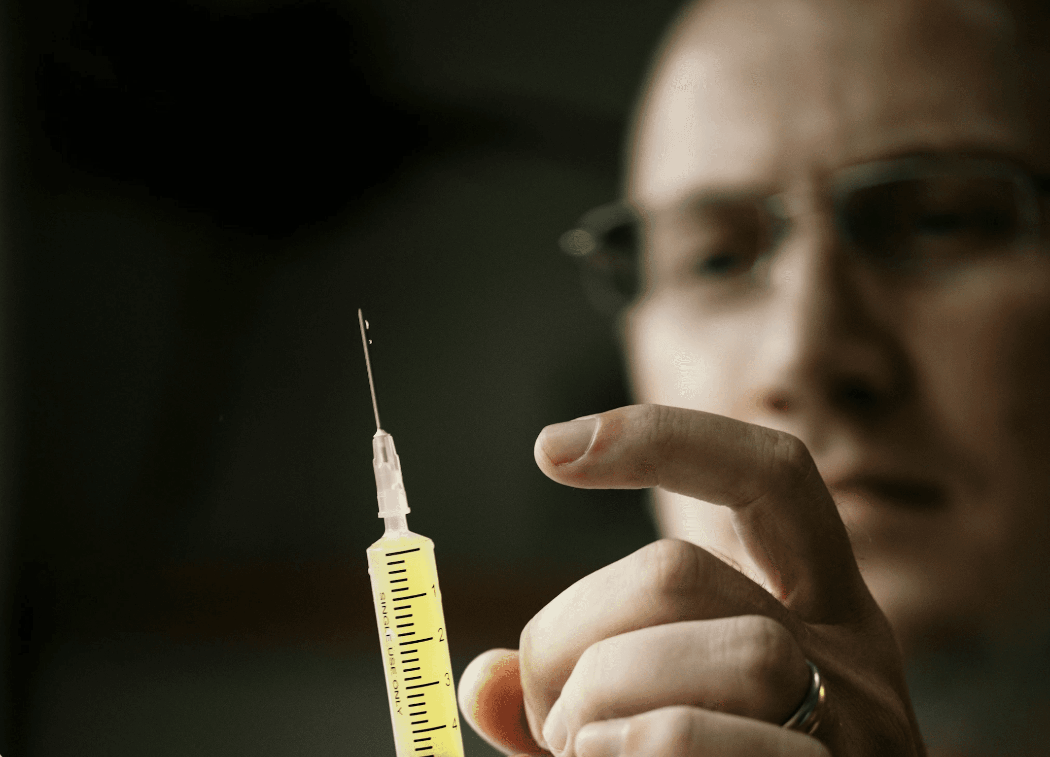 doctor with vaccination needle