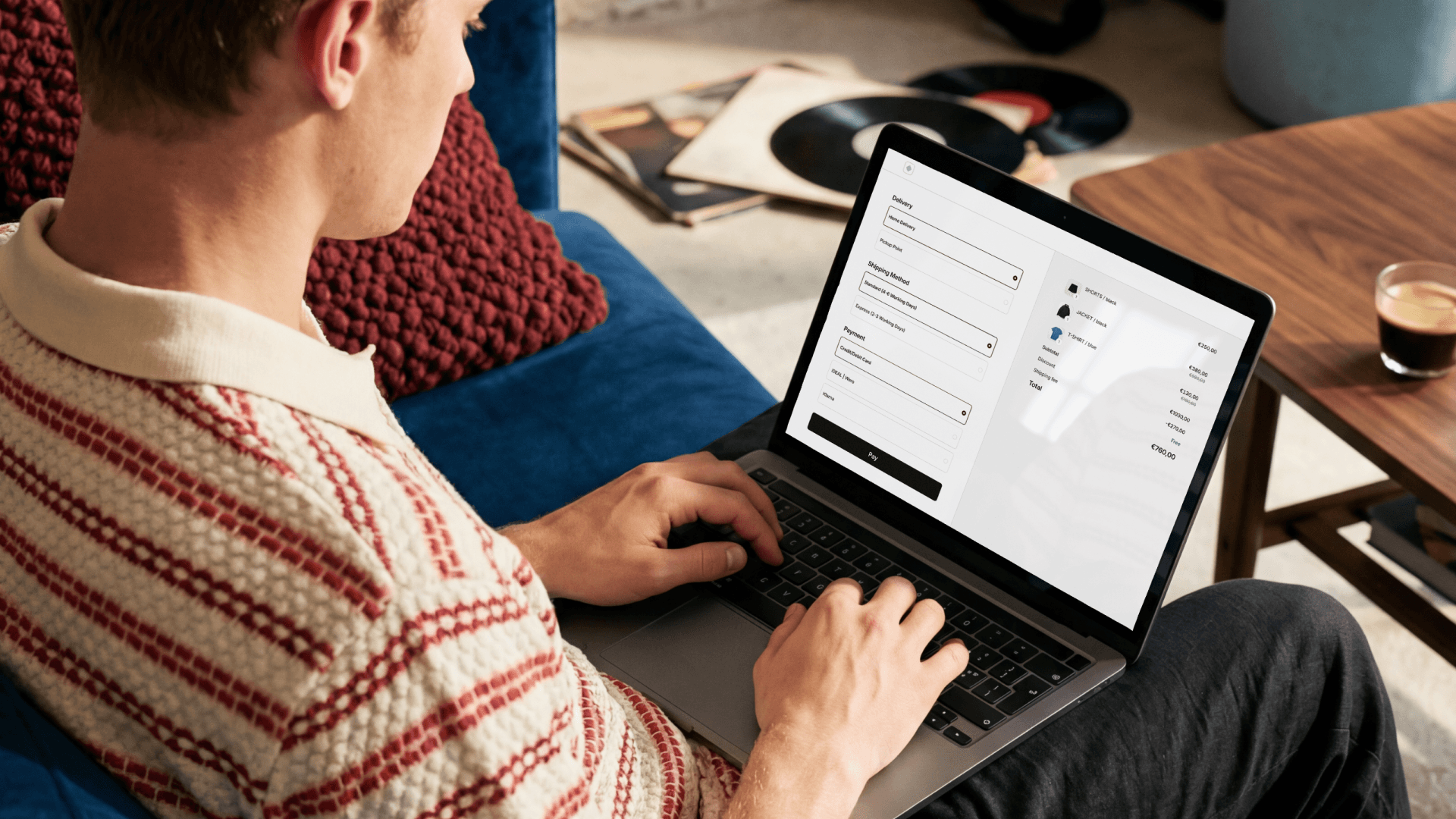 An image showing a man checking out on his laptop