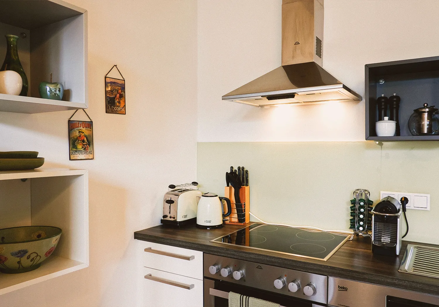 Boutique N°2 • kitchen counter with a ceramic hob, toaster, kettle and coffee machine
