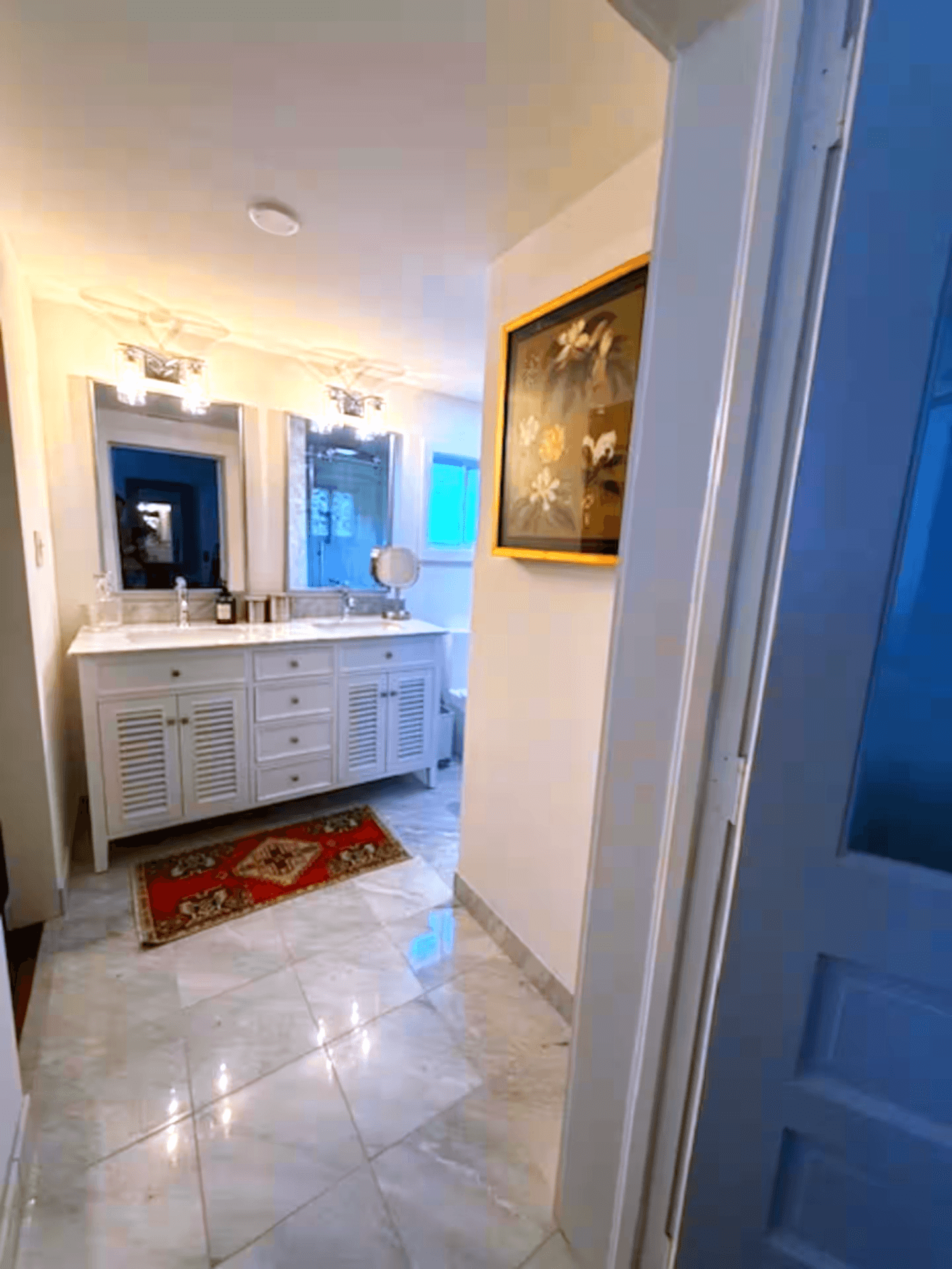 Spacious walk-in shower stocked with premium soaps, conditioners, plush towels, and a cozy bathrobe.