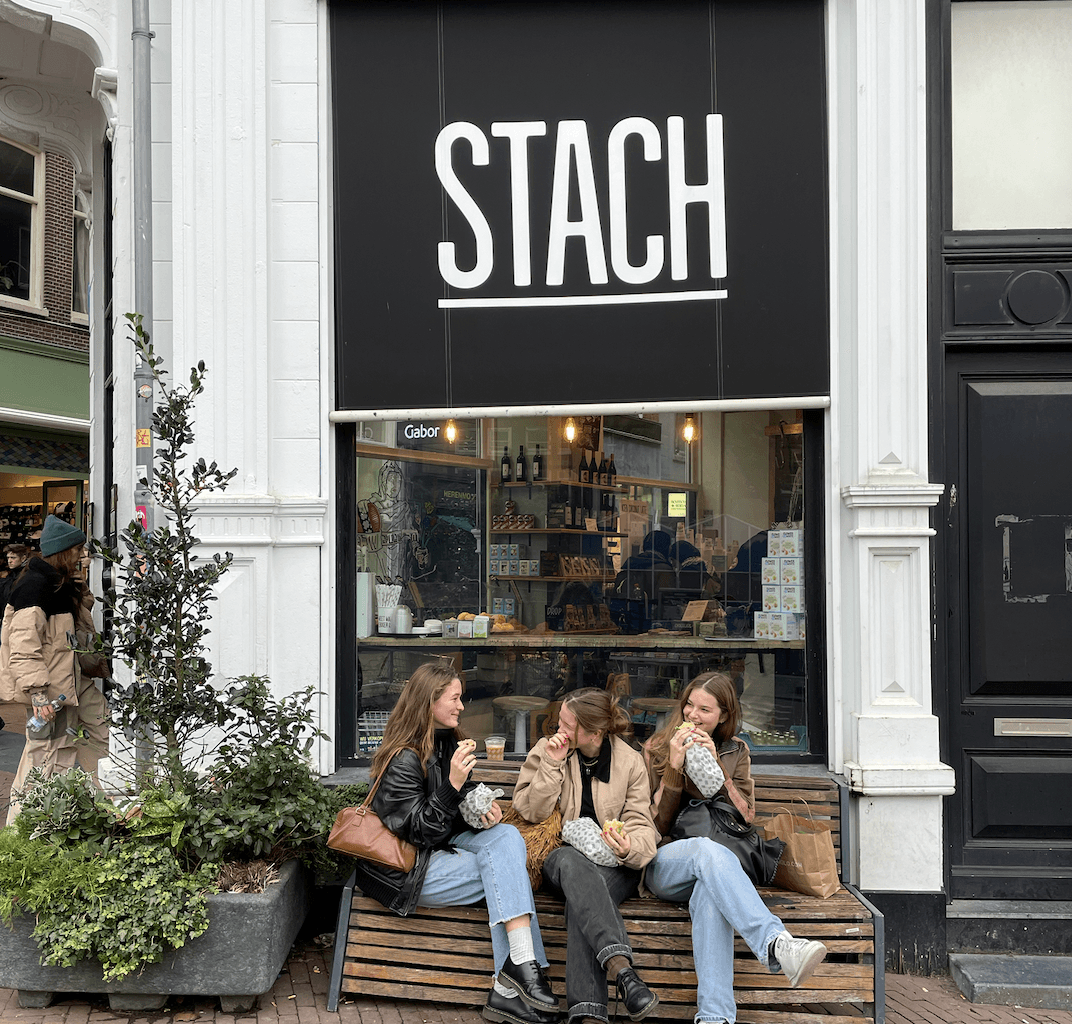 Picture of 3 women sitting in front of a stach