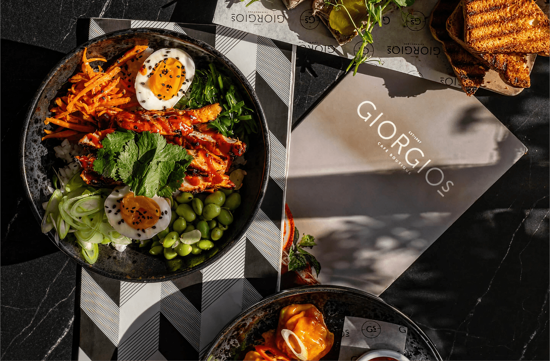 an interior of a fine dining restaurant with focused shot on the table with the plates and glass has been served