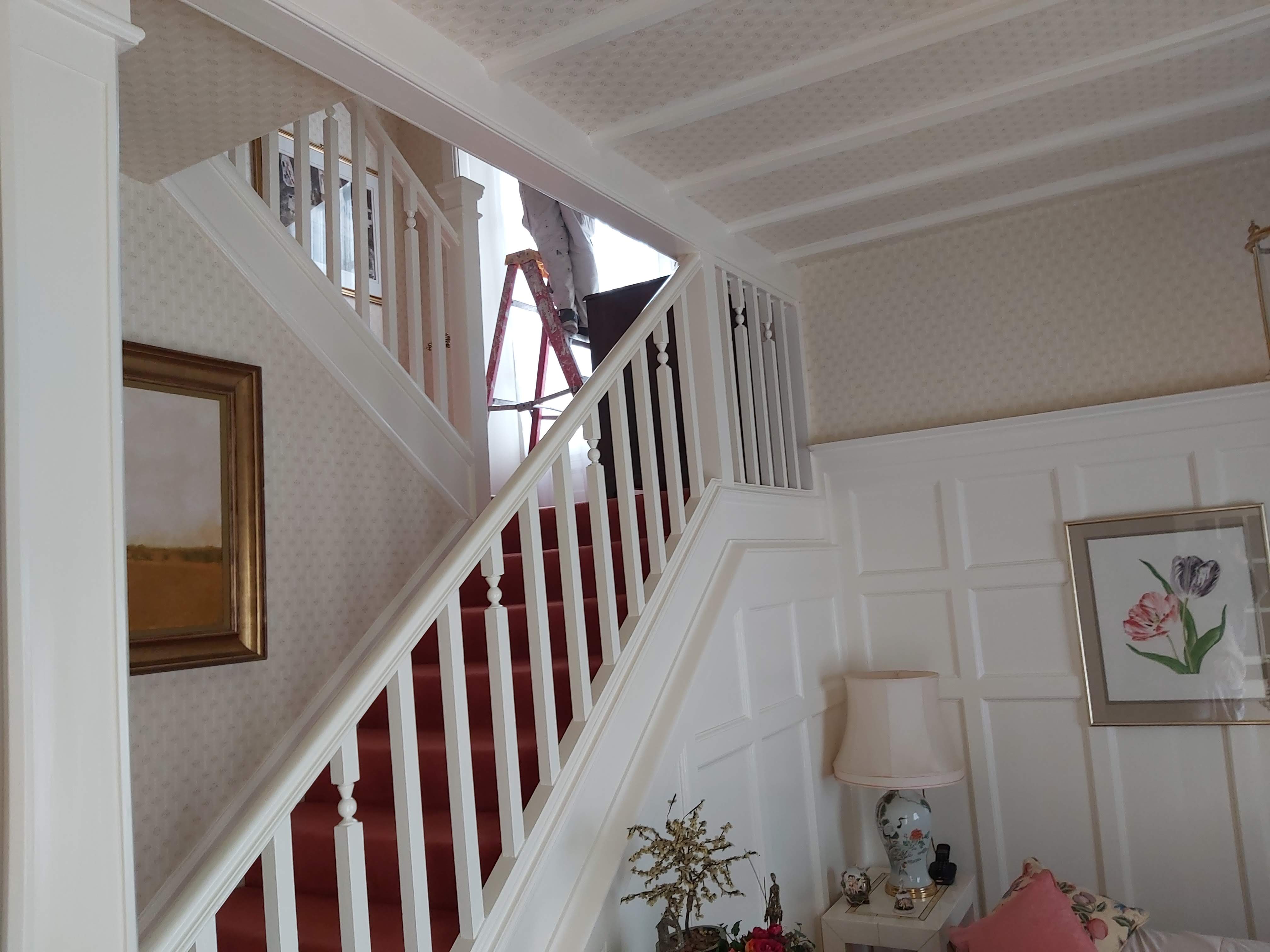 An old fashioned guard rail leading up a set of stairs
