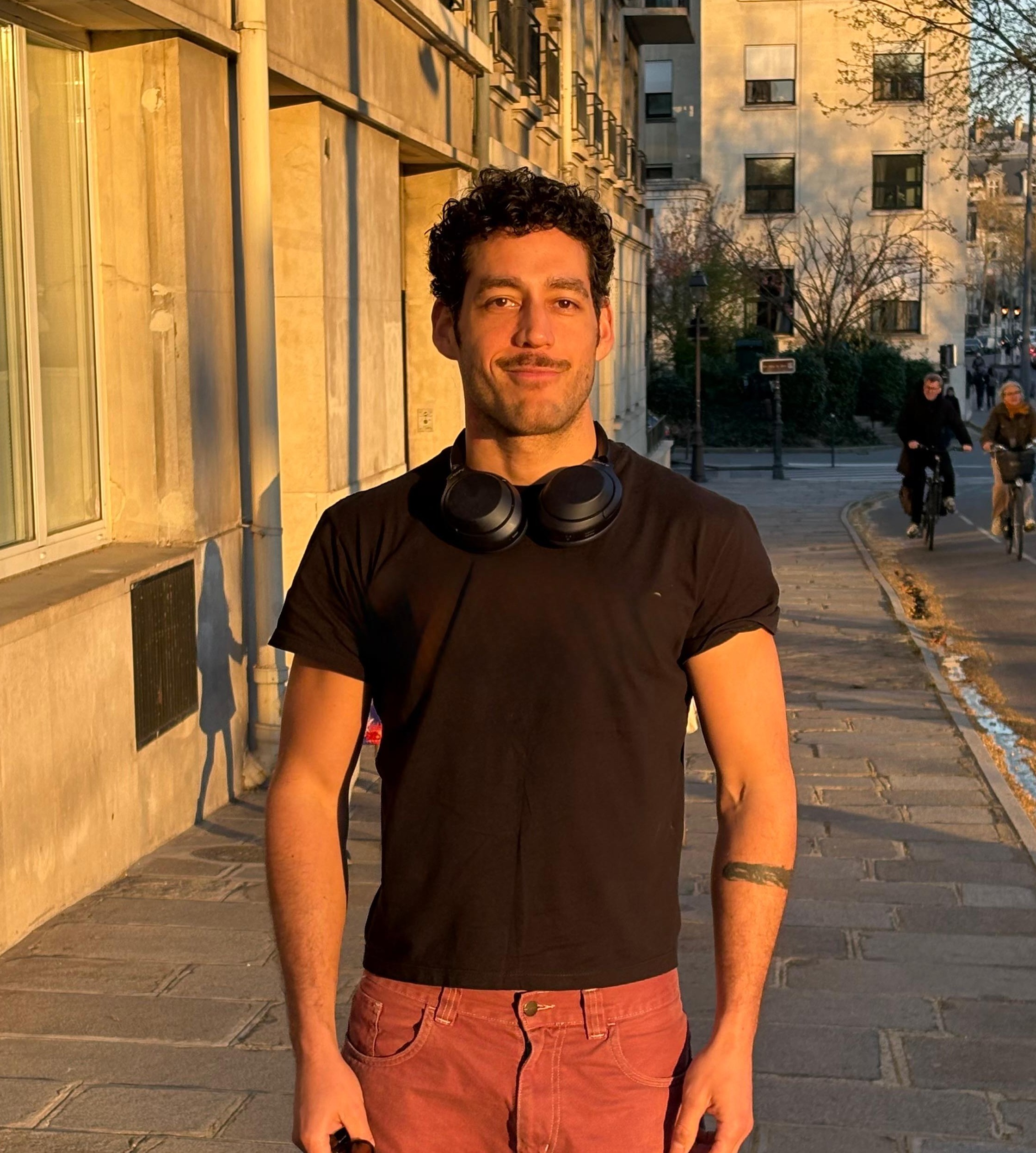 smiling woman sitting on grass during daytime